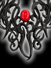 Load image into Gallery viewer, Black latex ornate pattern red stone necklace w/ arrow clasp, box, &amp; care instructions
