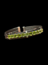 Load image into Gallery viewer, Sterling silver &amp; black cuff bracelet w/ series of round light green gems
