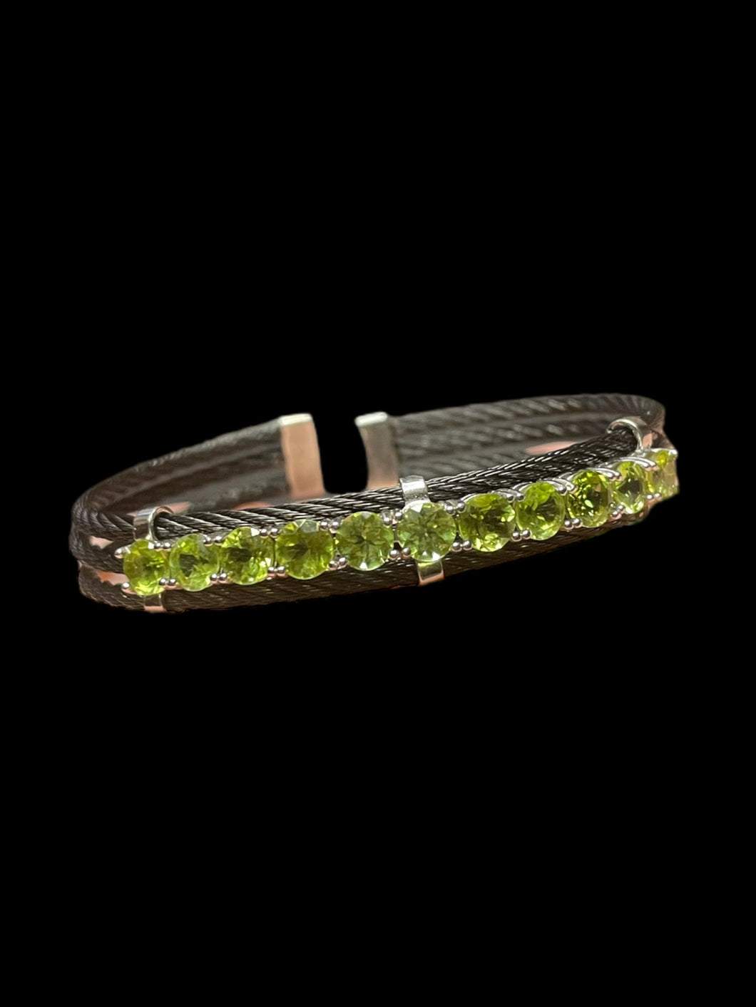 Sterling silver & black cuff bracelet w/ series of round light green gems