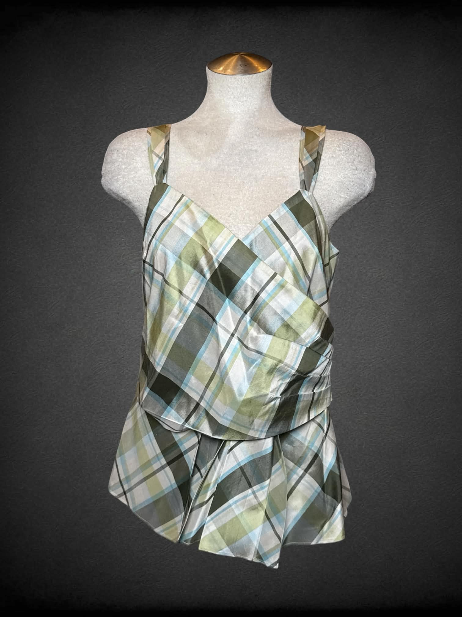L Ann Taylor green silk plaid blouse with asymmetrical cut on front, and hidden zipper on side