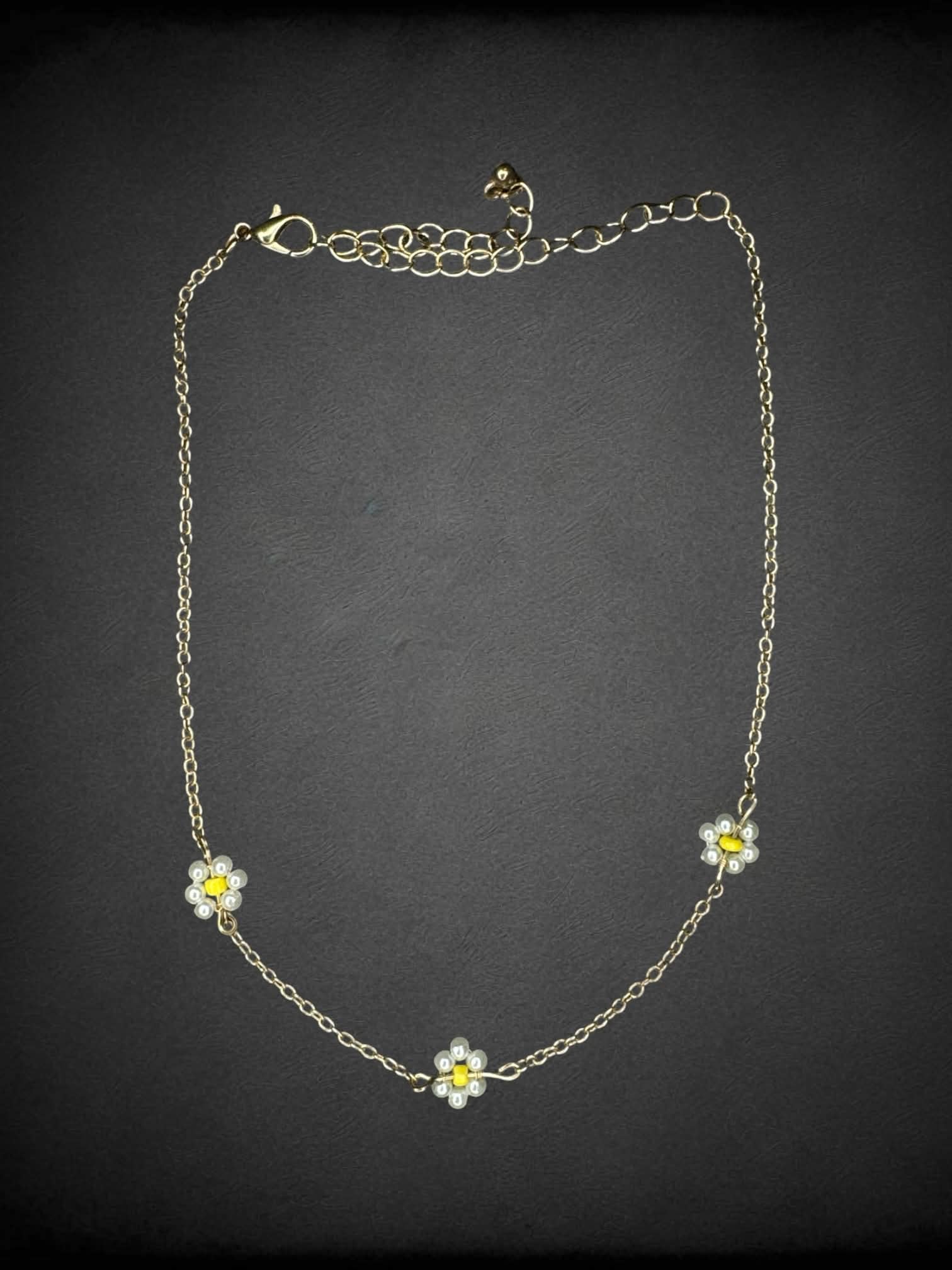 Gold chain choker with beaded daisy charms