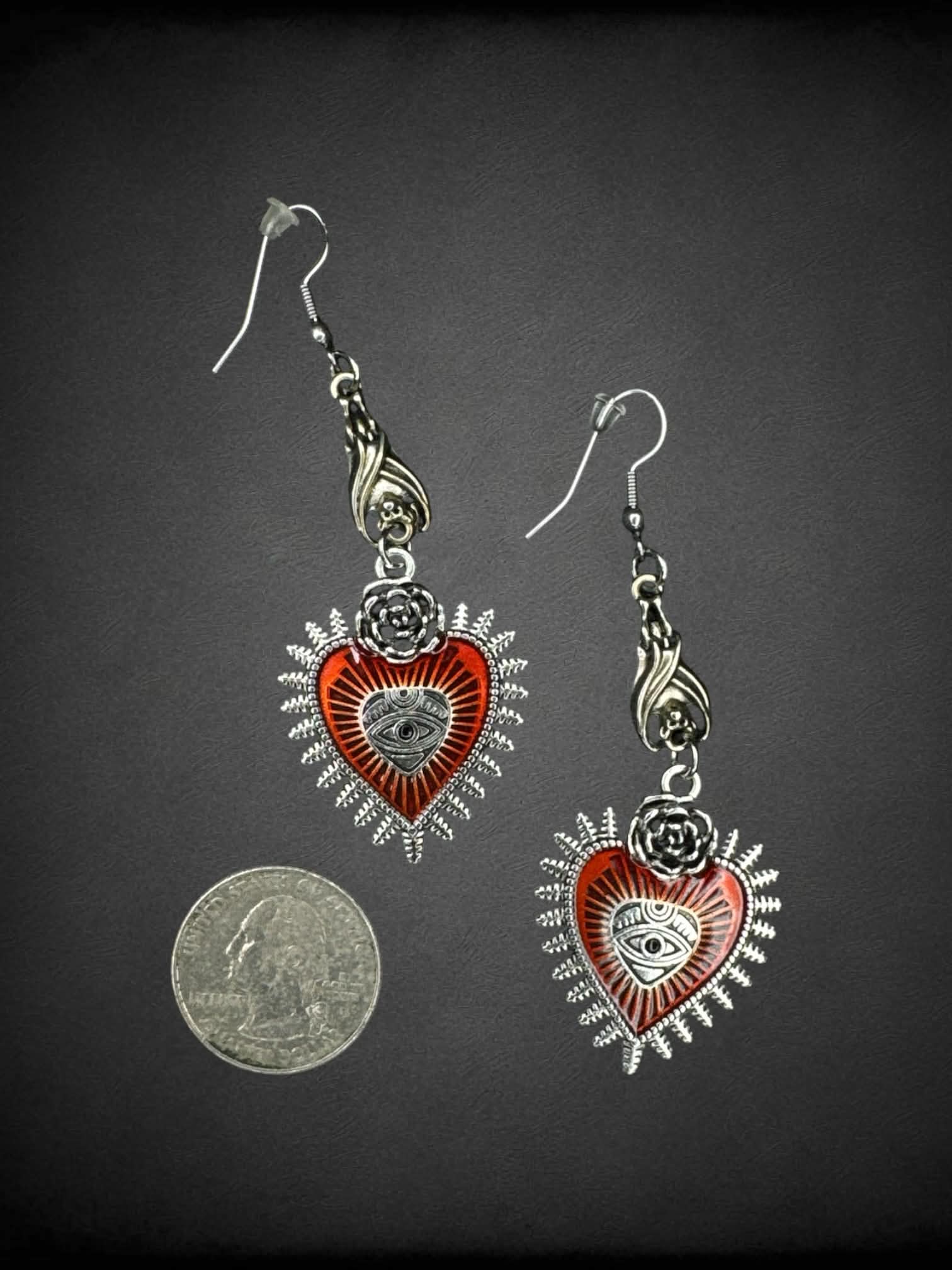 Silver bat earrings with red heart eye charms