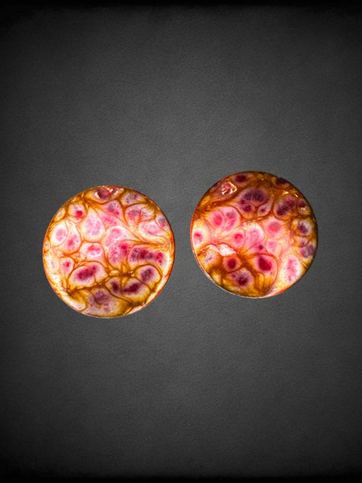Circular pink & gold clip-on earrings with abstract design