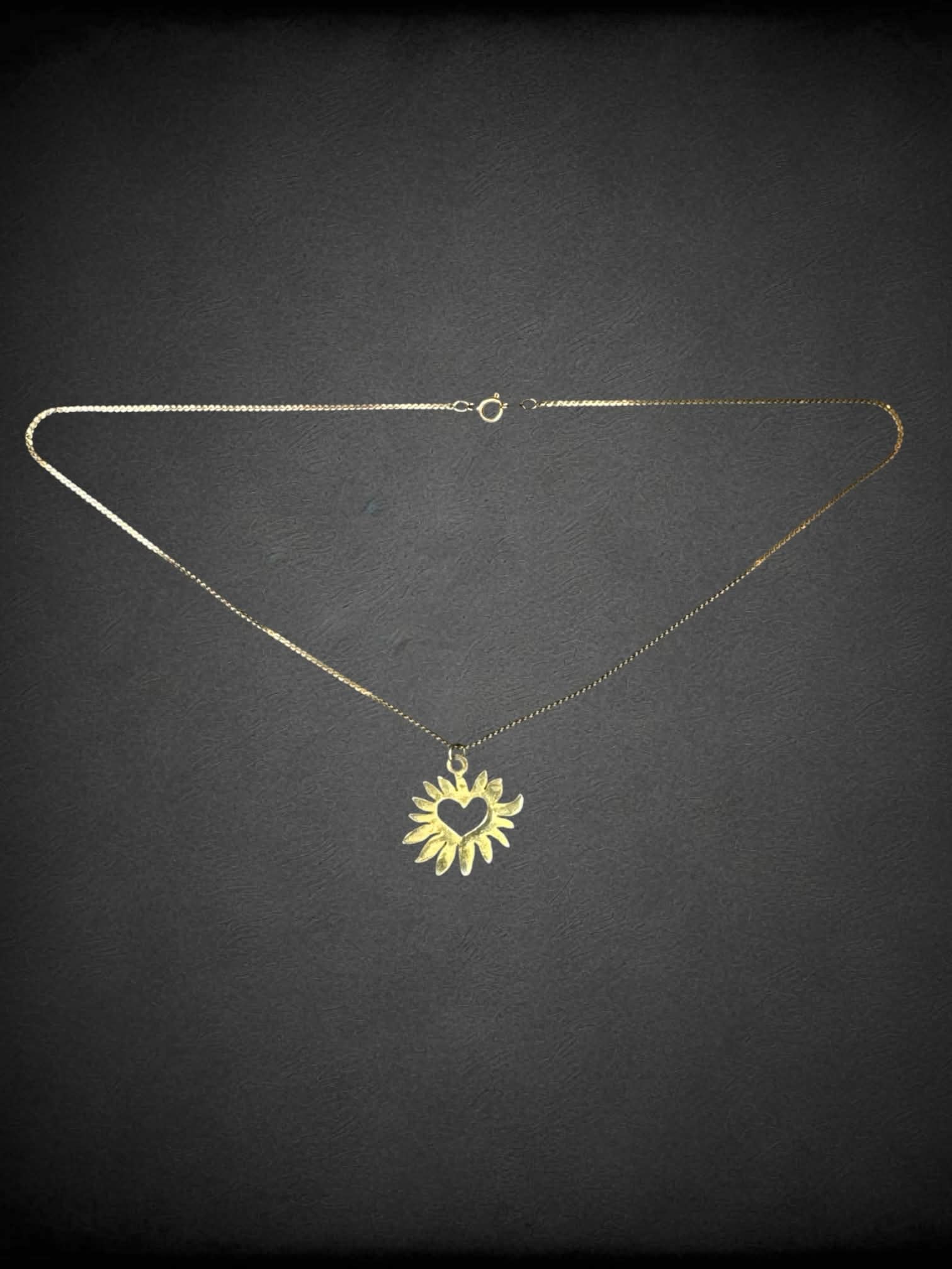 Gold chain necklace with sun heart charm