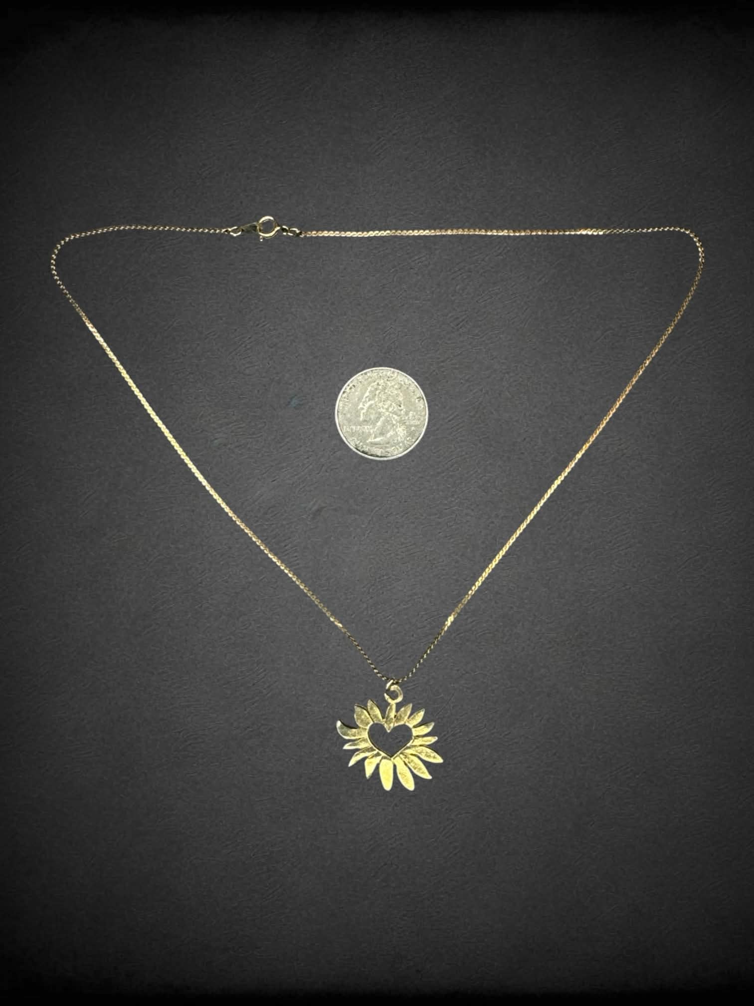 Gold chain necklace with sun heart charm