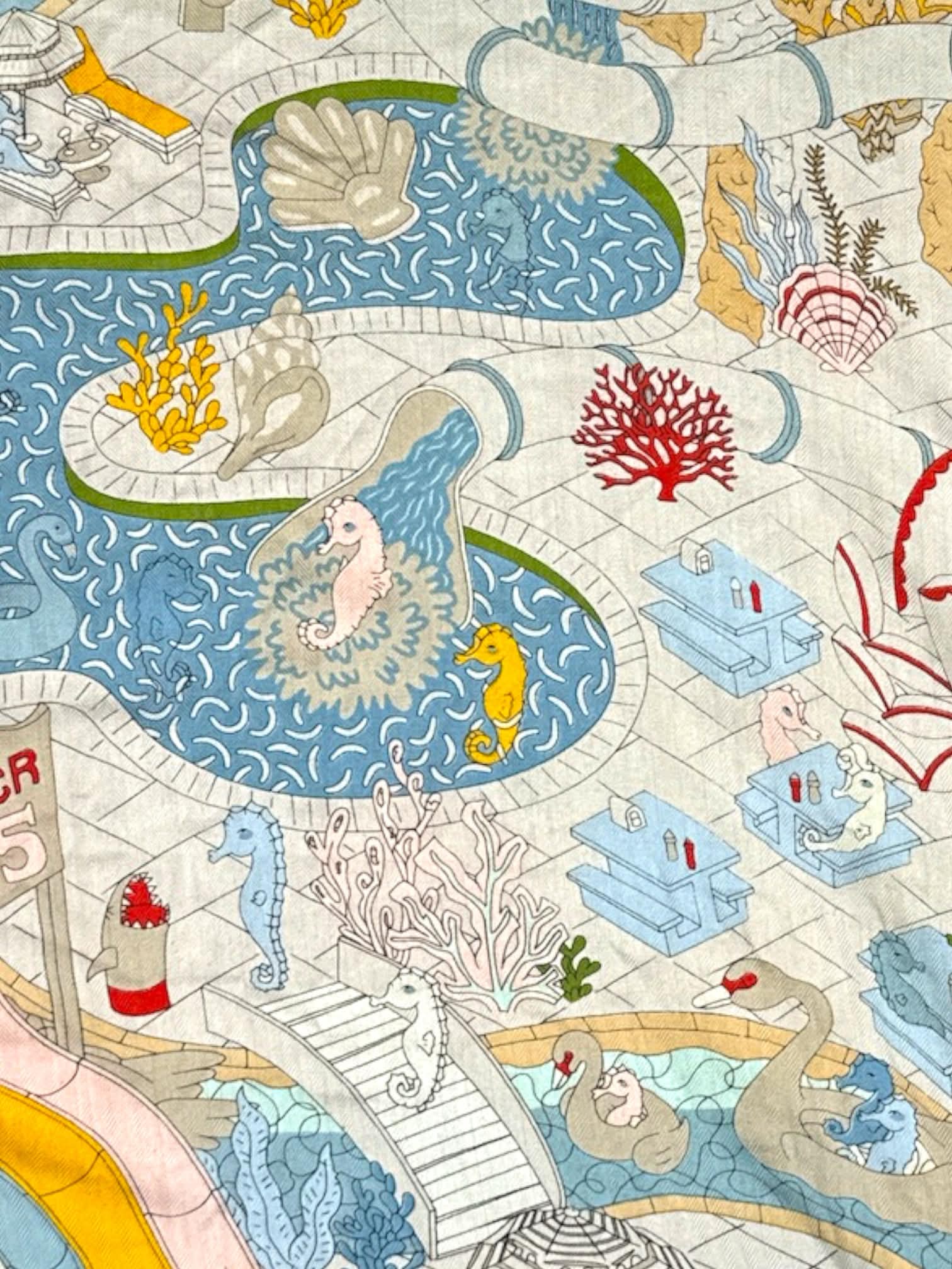 White tapestry with colorful aquatic design