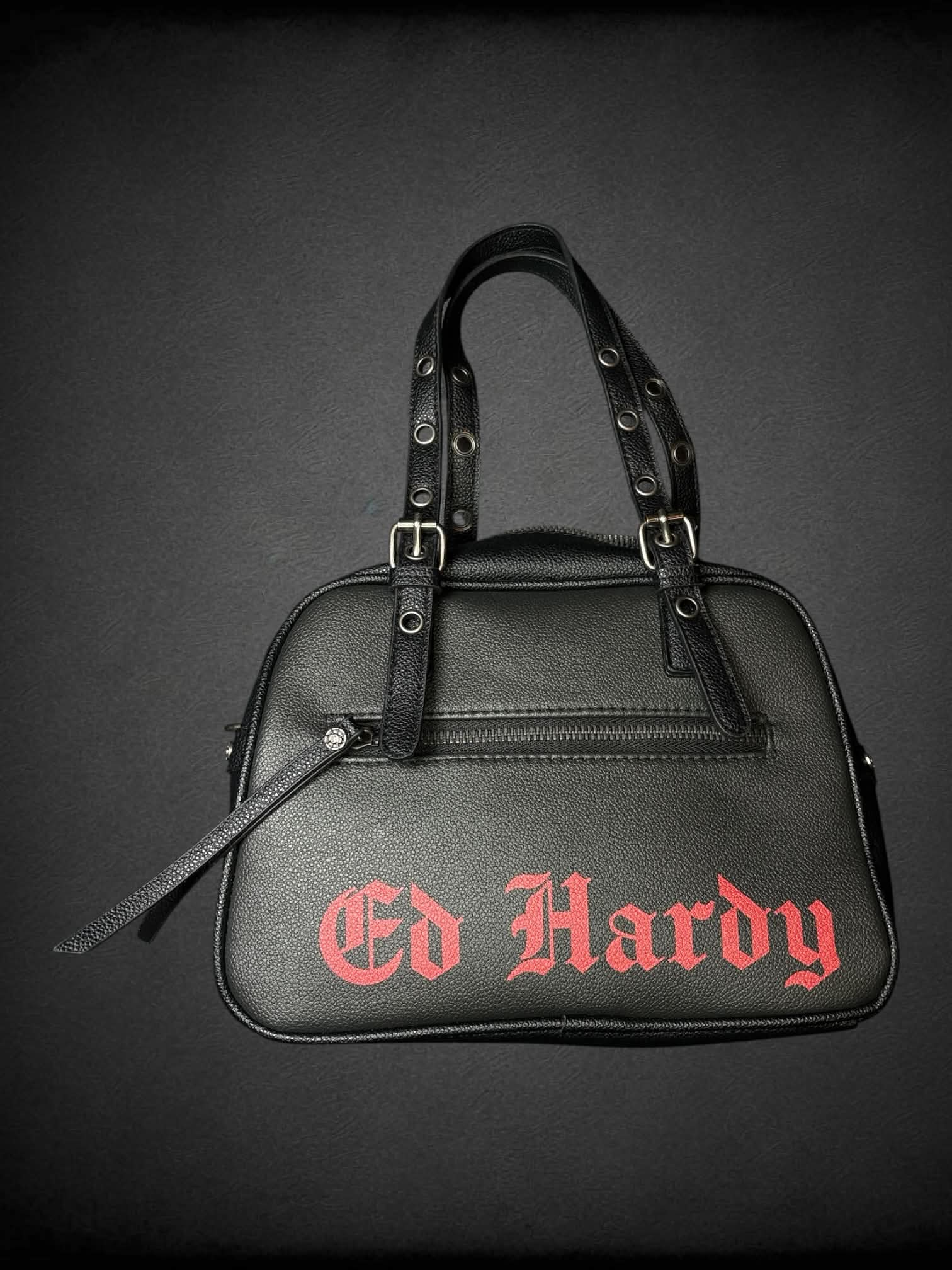 Ed Hardy black leather handbag with “Love Eternal” tattoo graphic on front, and “Go Hardy” writing on back, with zipper pocket
