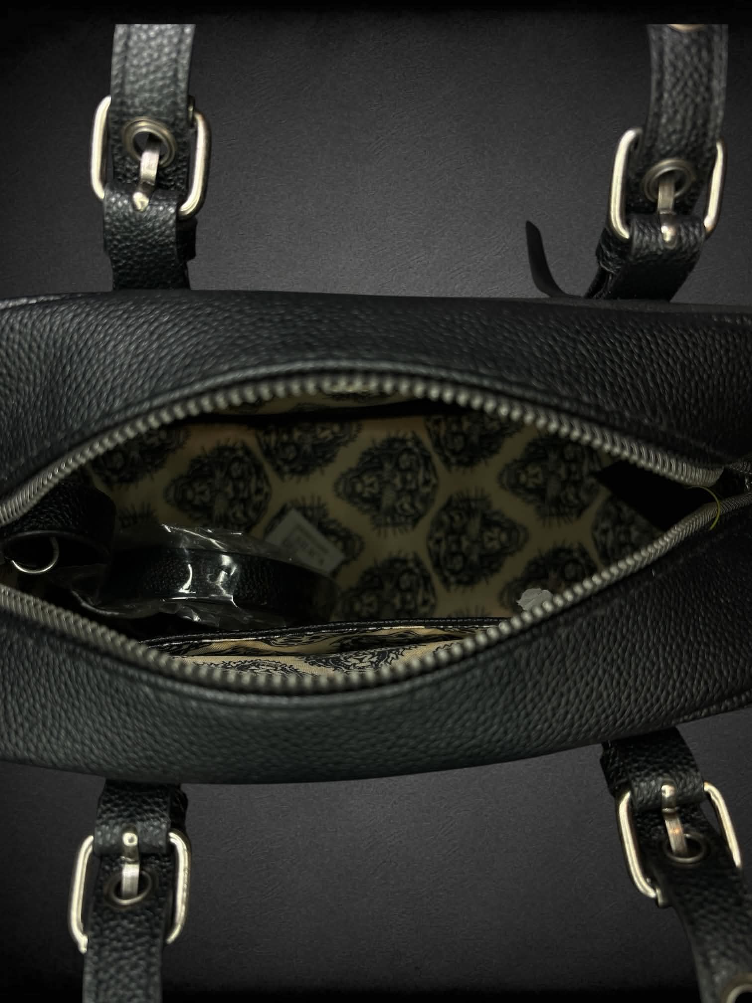 Ed Hardy black leather handbag with “Love Eternal” tattoo graphic on front, and “Go Hardy” writing on back, with zipper pocket