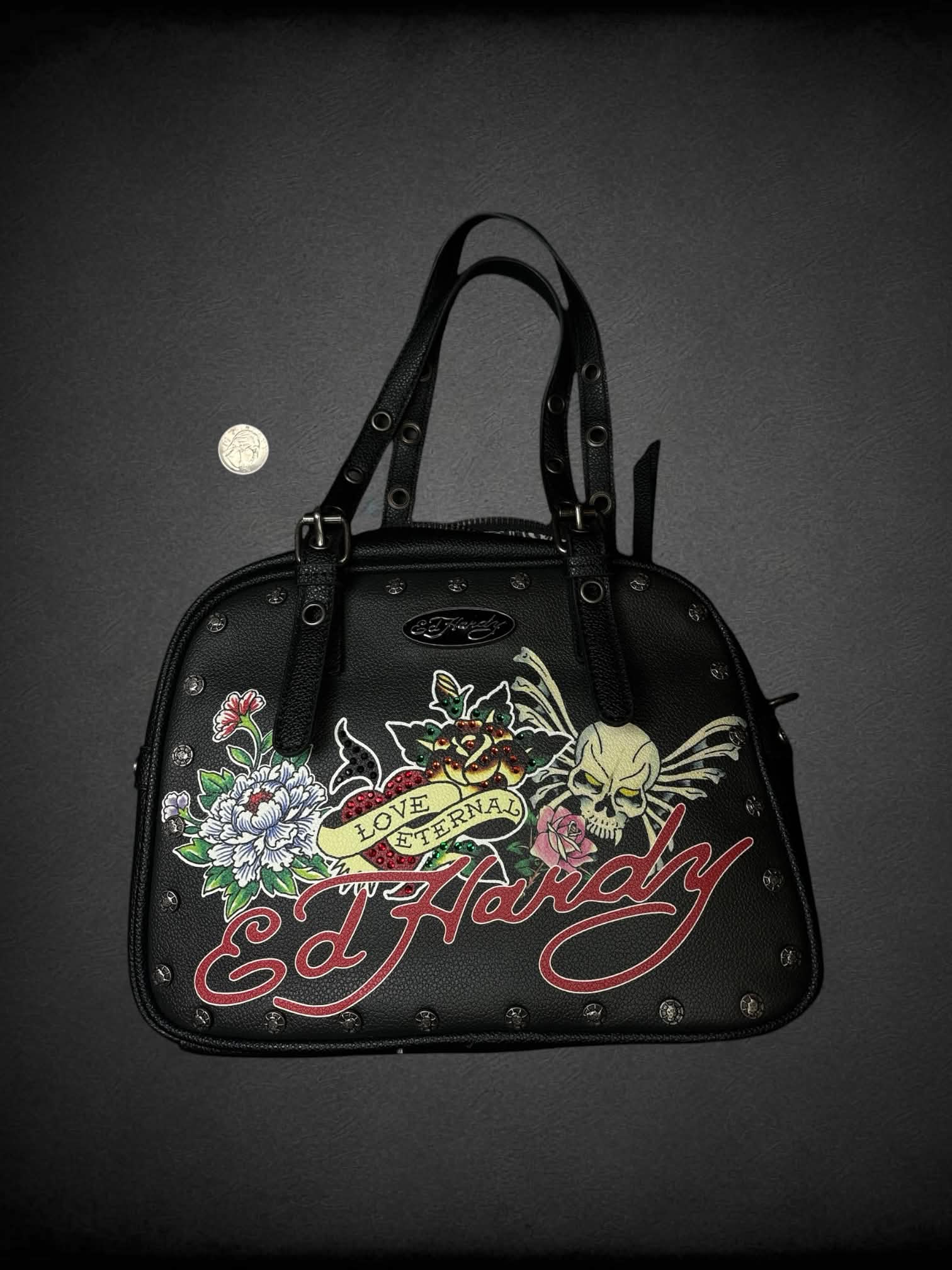 Ed Hardy black leather handbag with “Love Eternal” tattoo graphic on front, and “Go Hardy” writing on back, with zipper pocket