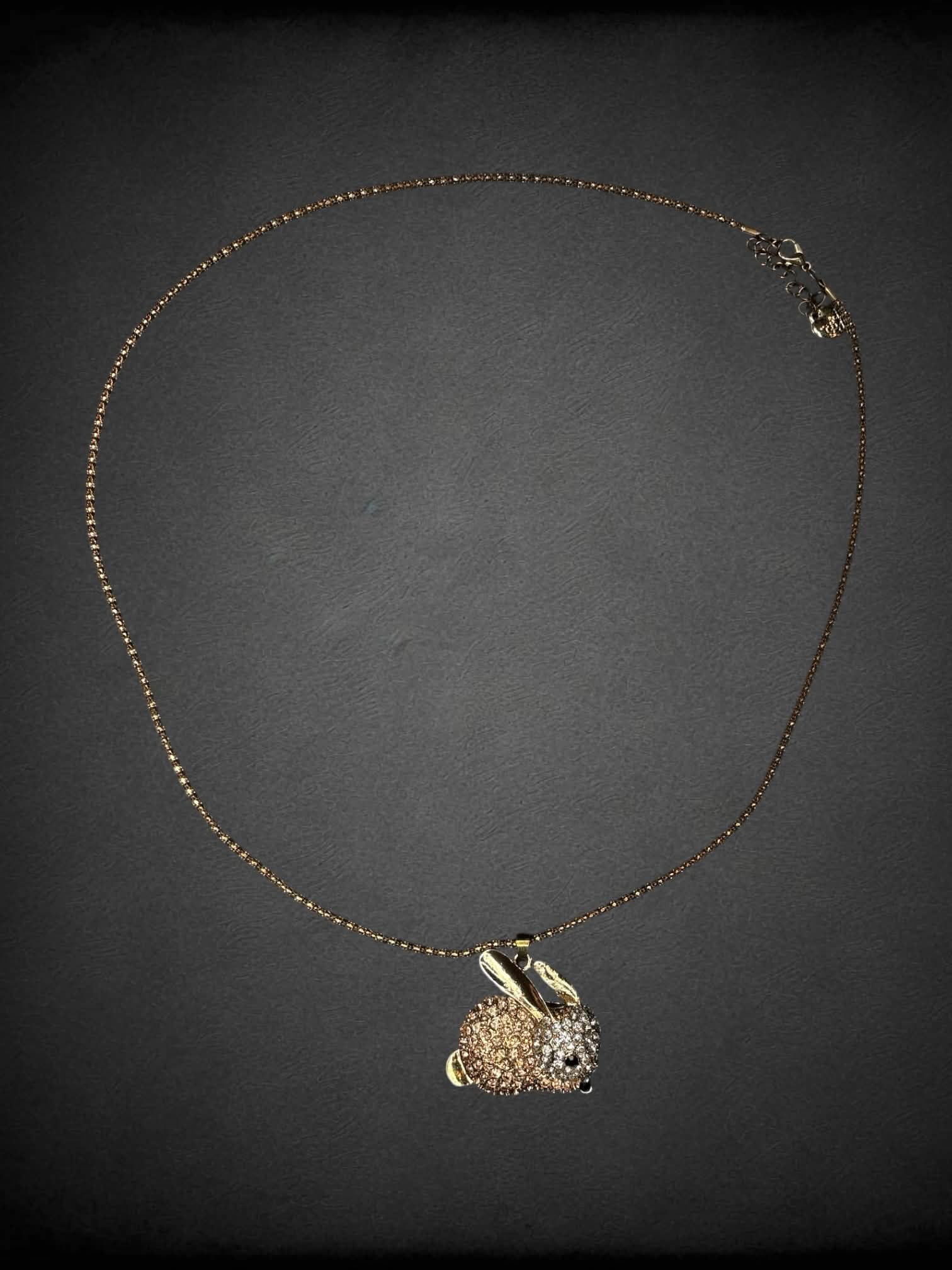 Gold chain necklace with gemstone bunny charm