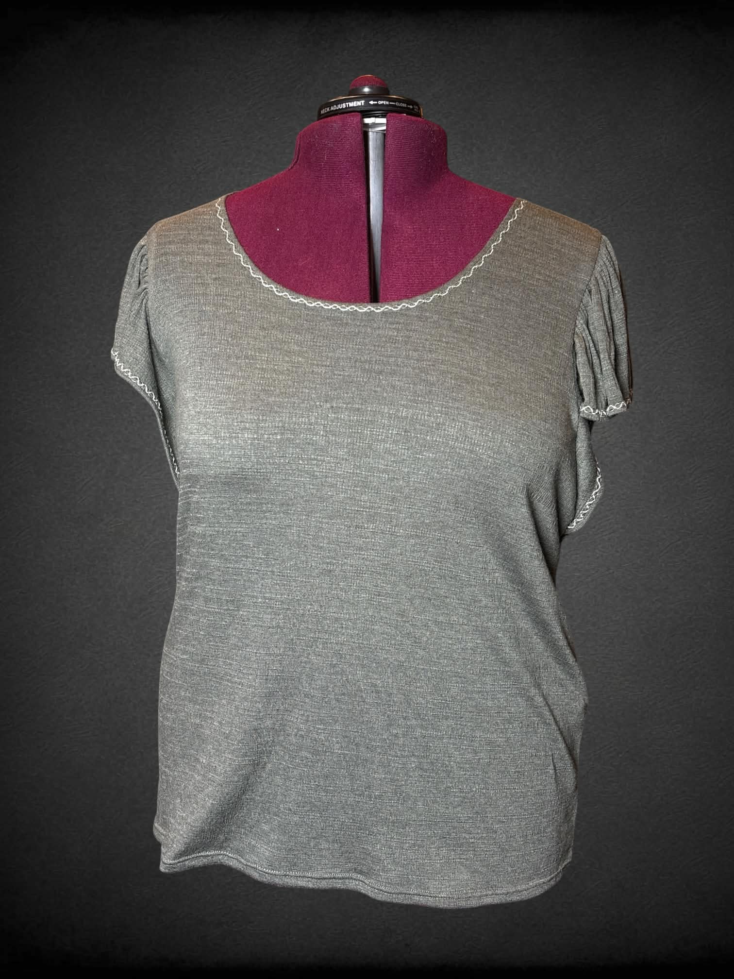 3X Max Studio soft green shirt with embroidery detailing on neck line, and ruffle sleeves