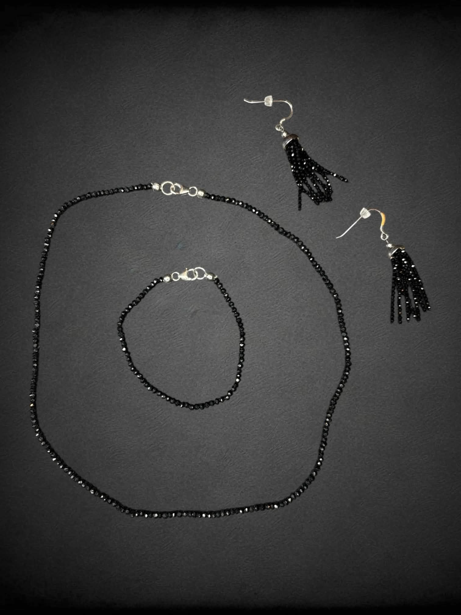 Black beaded three-piece set with necklace, bracelet and earrings