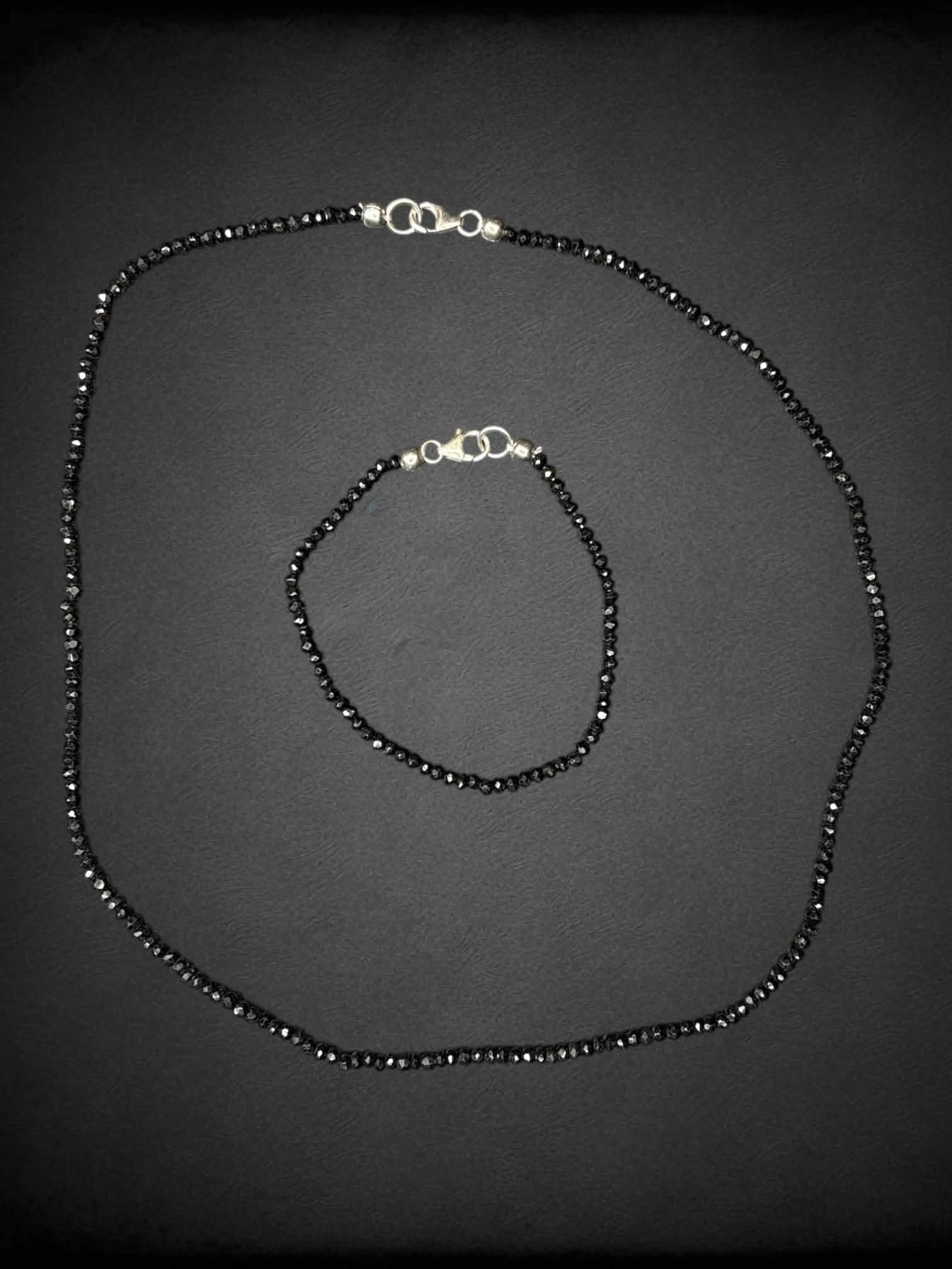 Black beaded three-piece set with necklace, bracelet and earrings