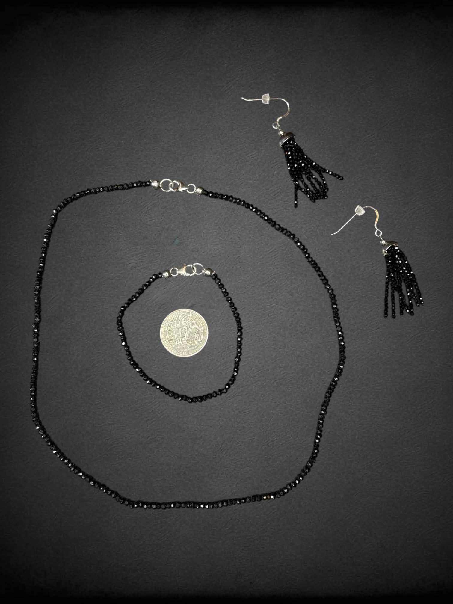 Black beaded three-piece set with necklace, bracelet and earrings