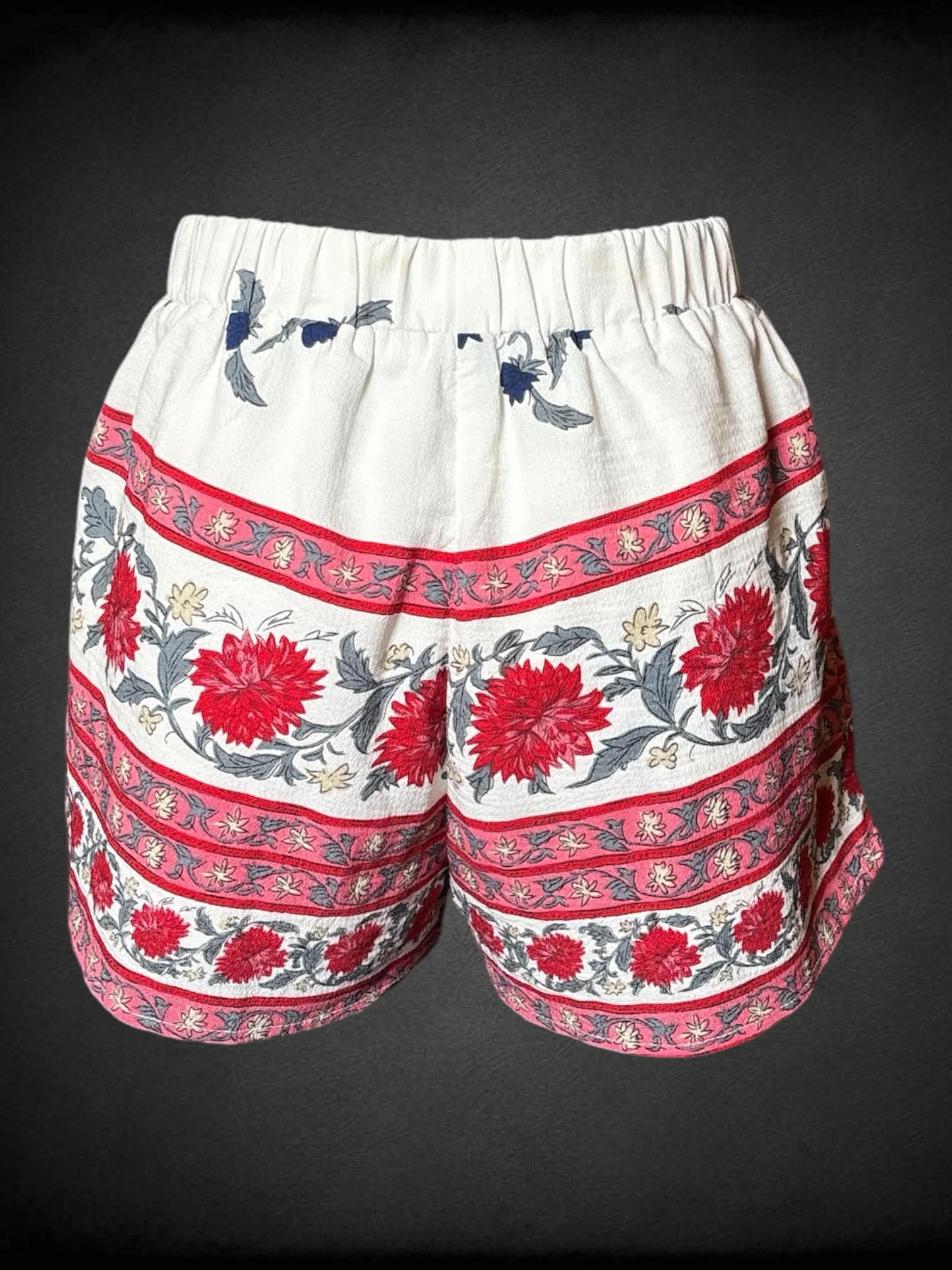 S Fashion Nova white shorts with red floral pattern, and stretch waist