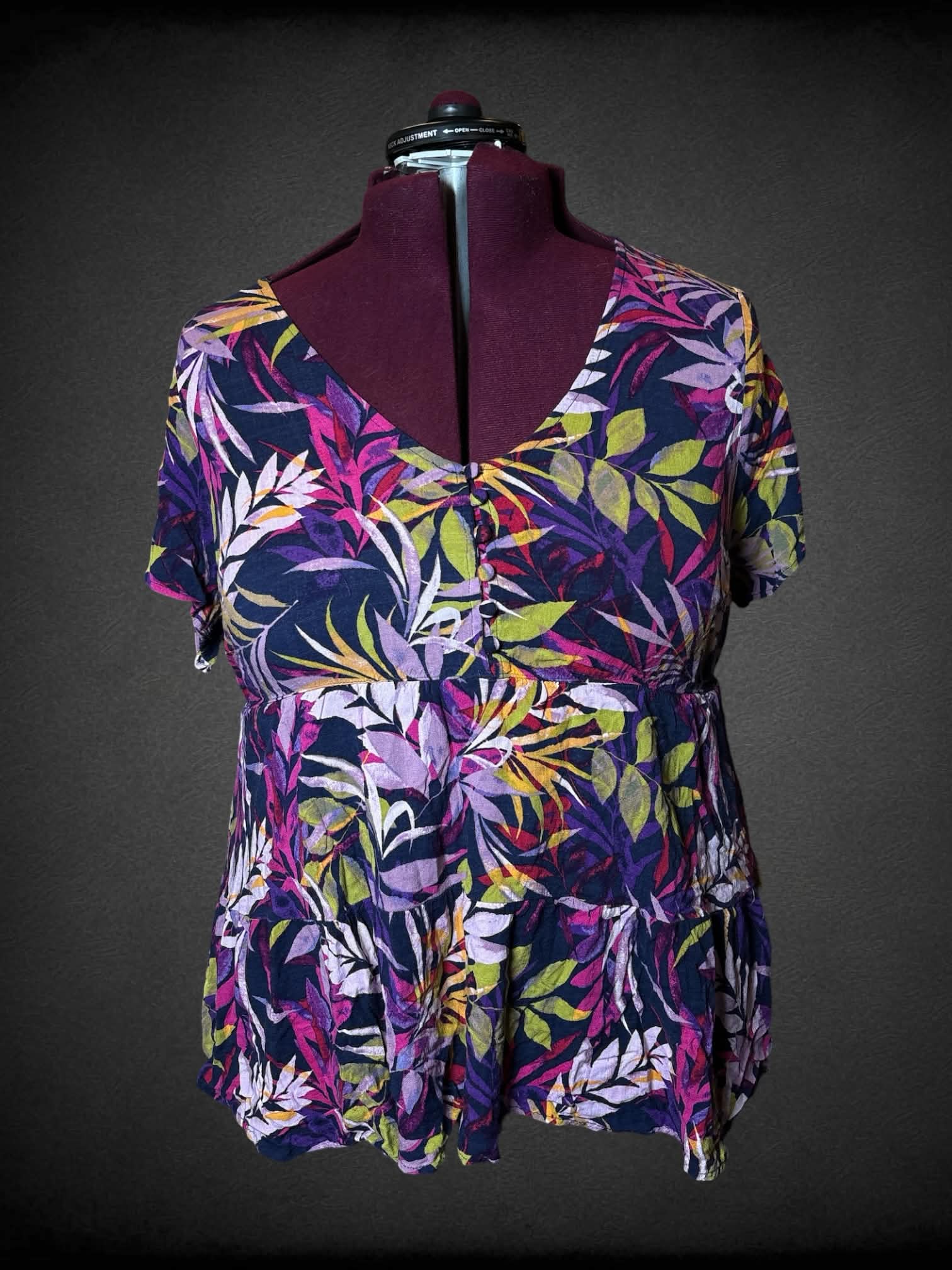 2X Torrid purple blouse with colorful botanical pattern, buttons on front, and empire waist seem