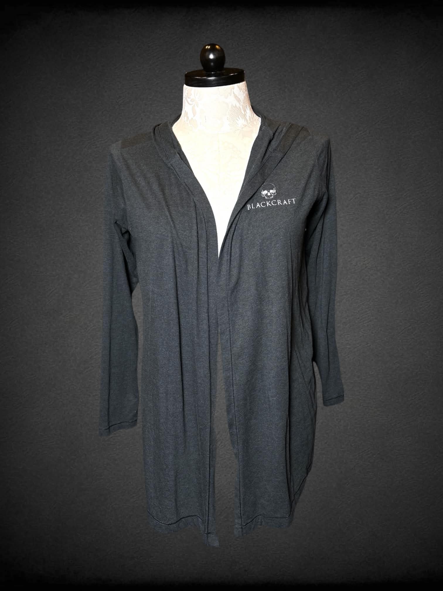 0X Black Craft grey hooded cardigan with “Know Your Power” moon and sword graphic on back