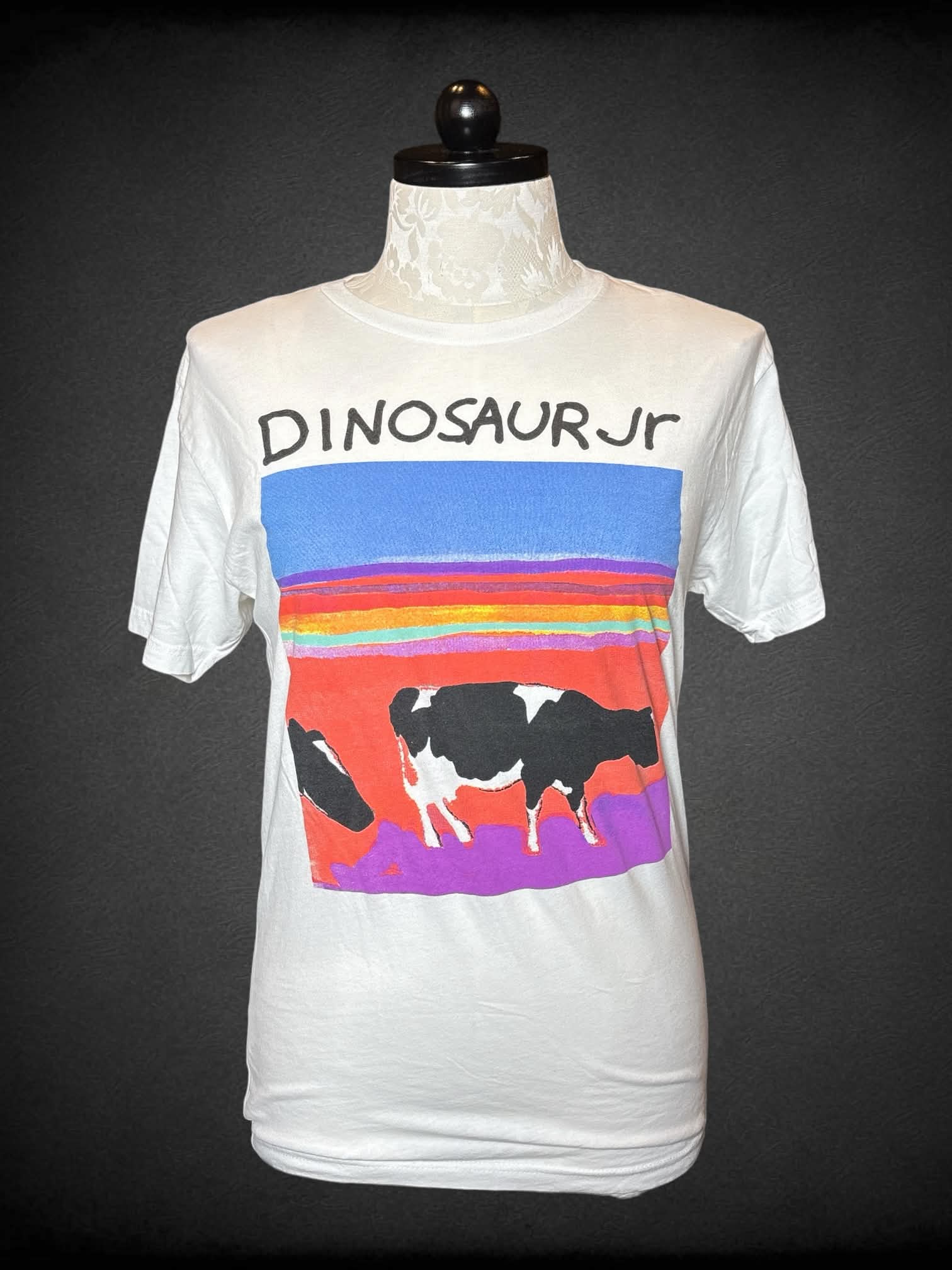 1X Next Level Apparel white t shirt with colorful cow “Dinosaur Jr” band graphic on front