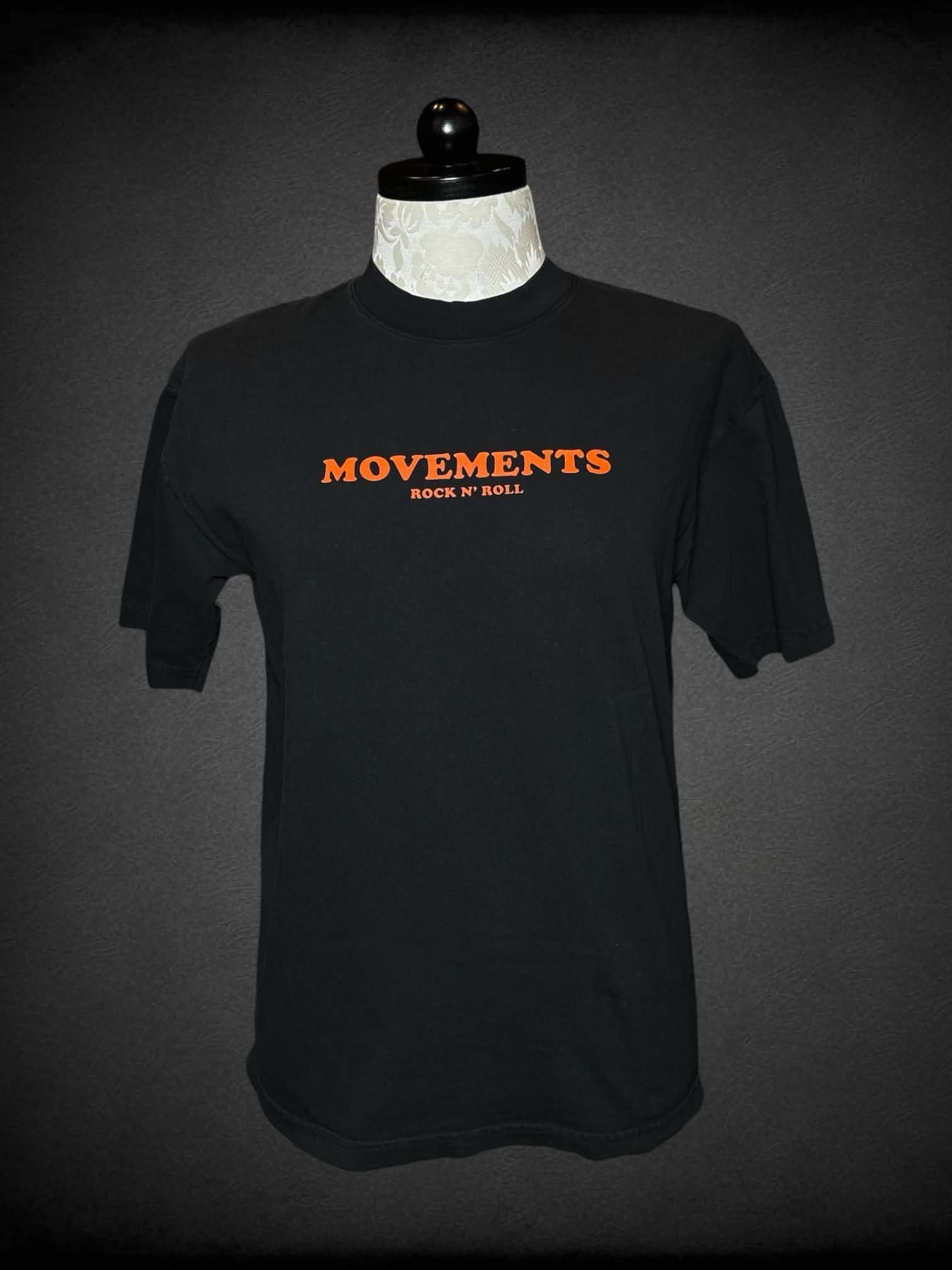 1X Los Angeles Apparel black t shirt with “Movements” band writing on front, and panther graphic on back