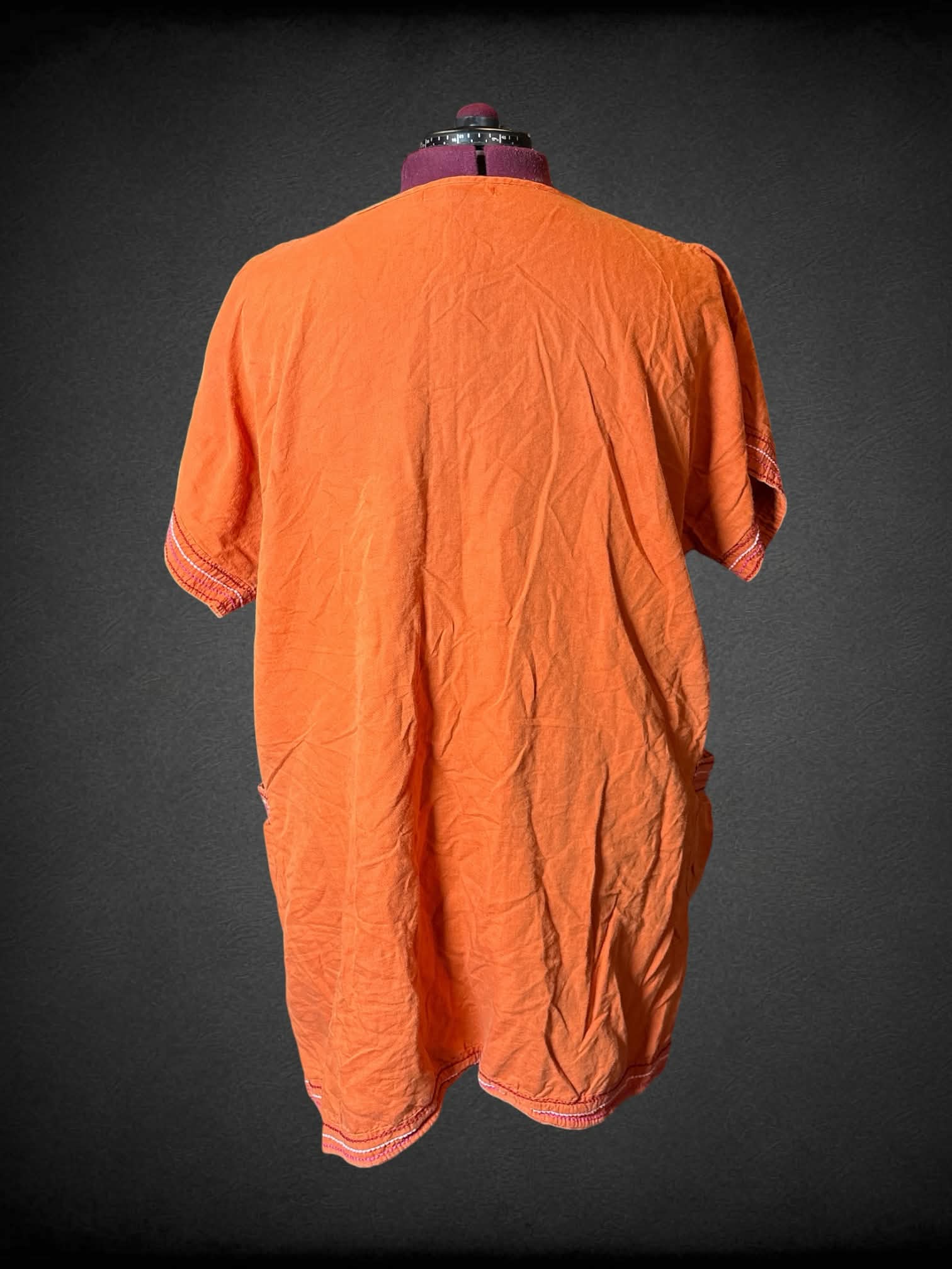 2X Gudren Sjoden Orange dress with buttons on front, pockets, and sewn pattern on hemline