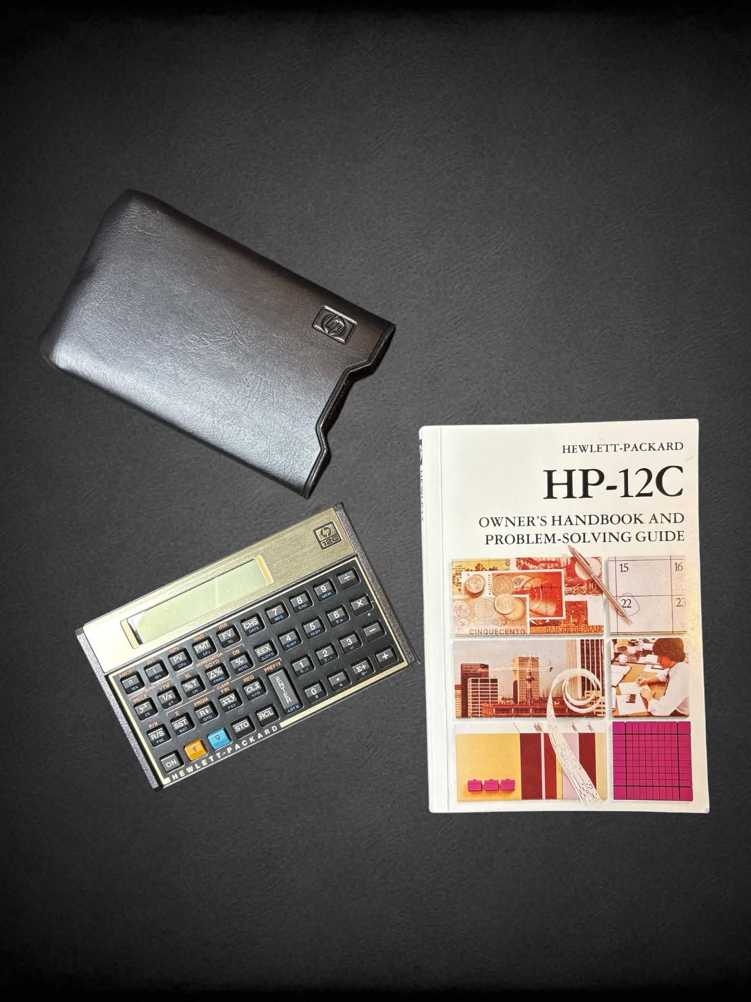 Vintage HP 12-C calculator & guidebook *needs new batteries*