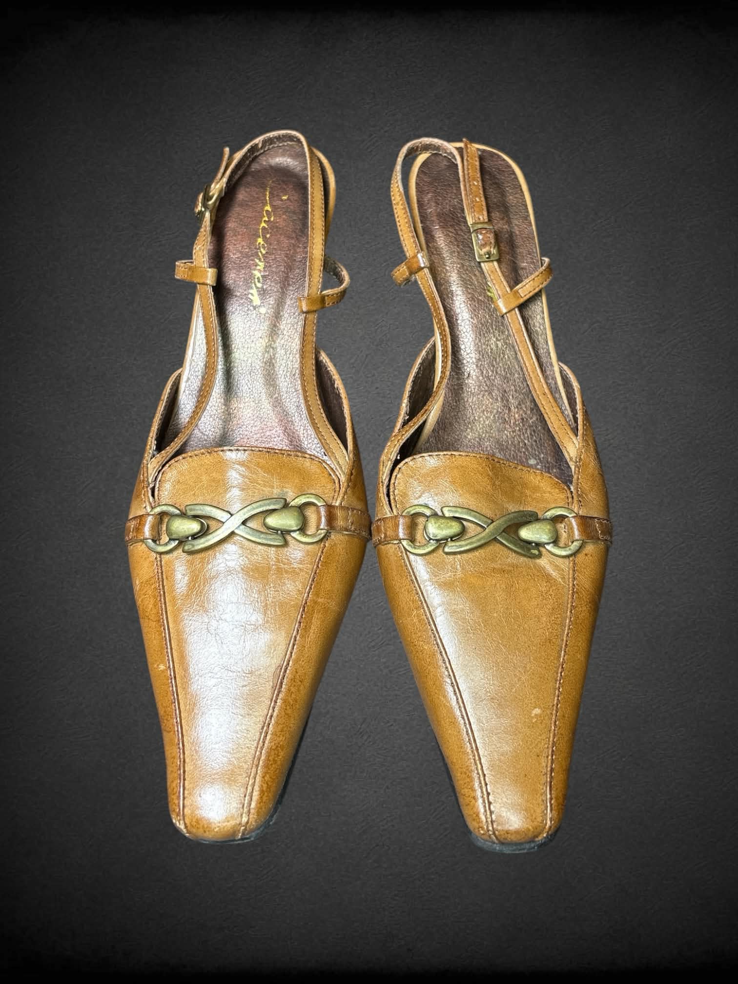 Size 7 Cacares brown leather kitten heels with bronze buckle on front