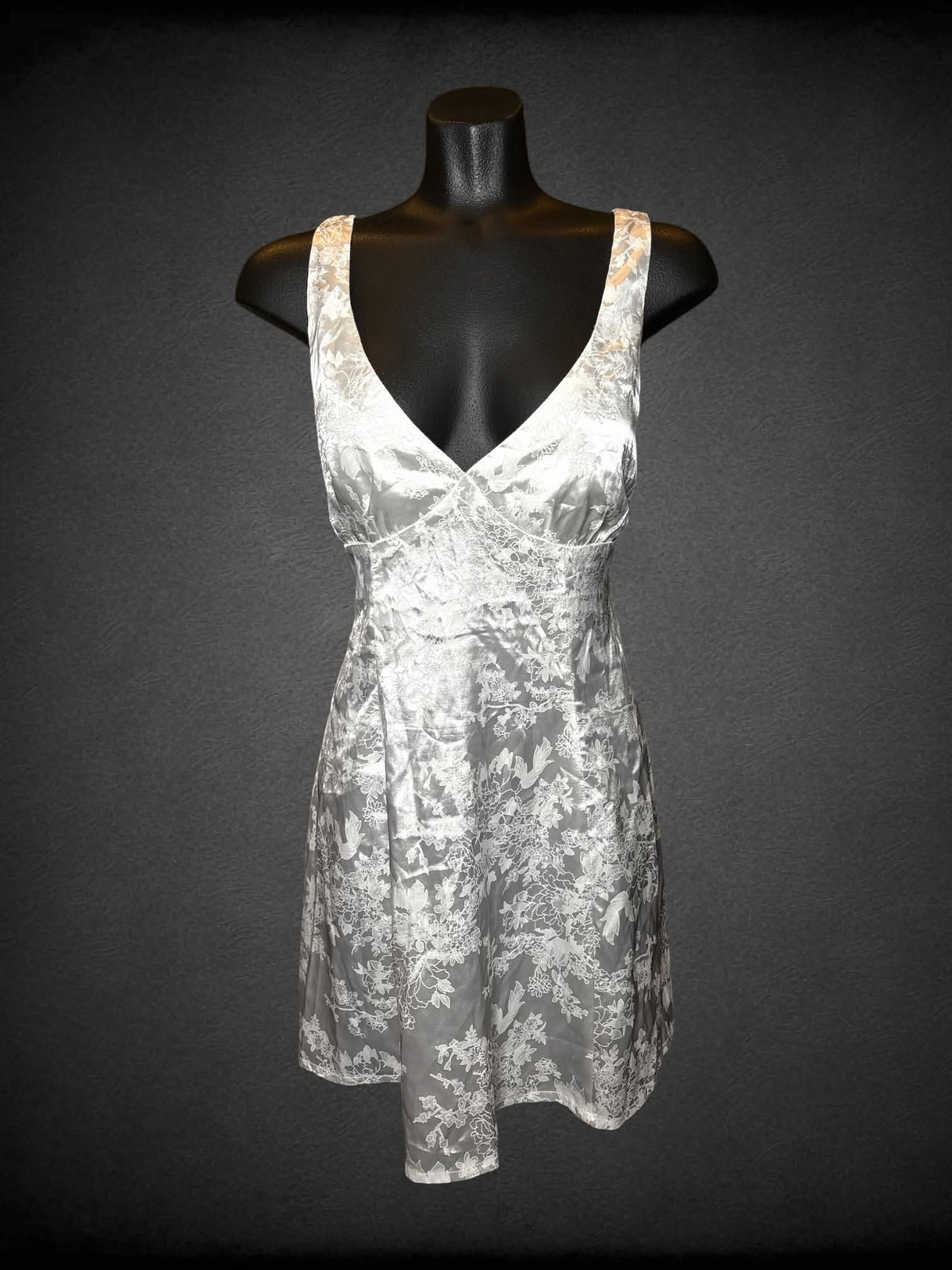 S Cider white short dress with cutout on back, floral embroidery pattern, and zipper on back
