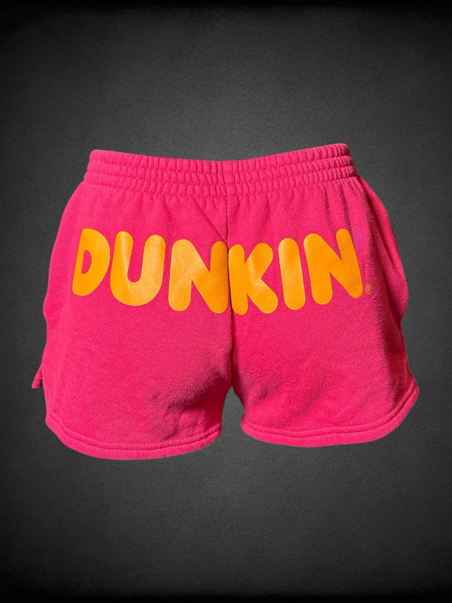 S Urban Outfitters x Dunkin’ hot pink sweat shorts with pockets, and “Dunkin’” logo on back