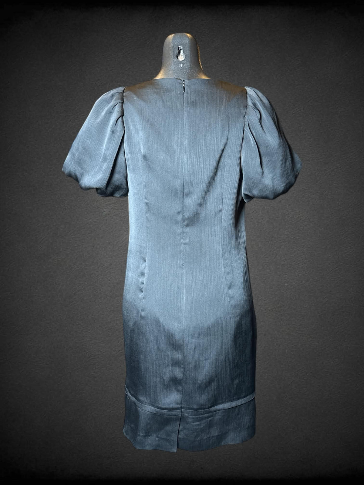 S Minimum black short dress with bubble sleeves, zipper on back, and black decorative buttons on neckline