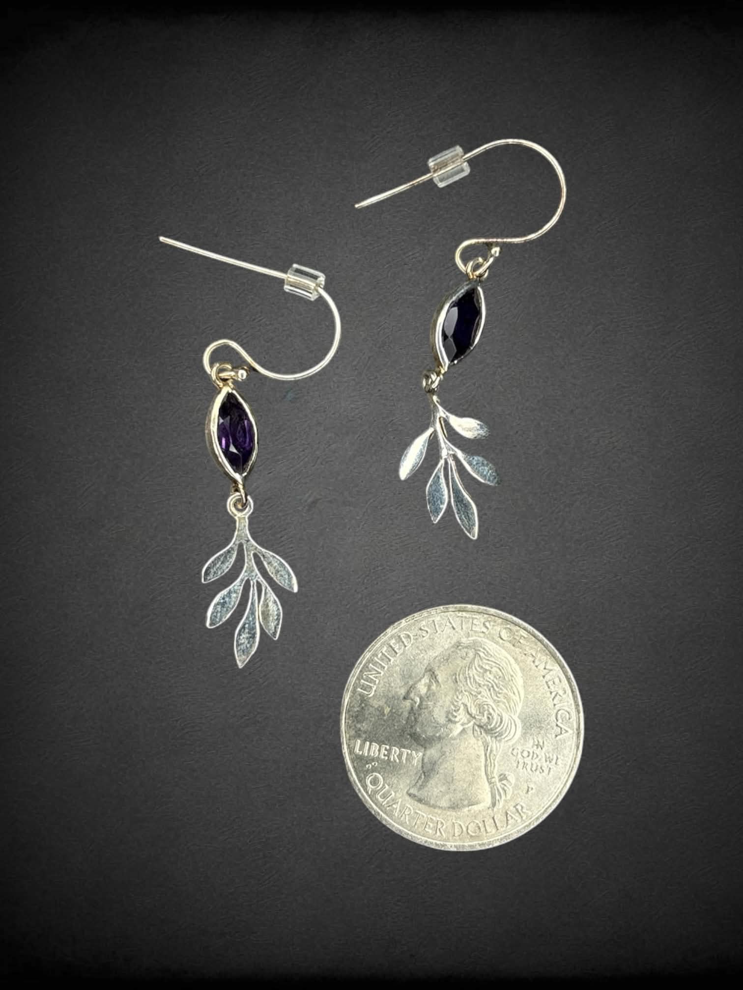 Silver leaf earrings with purple gemstone