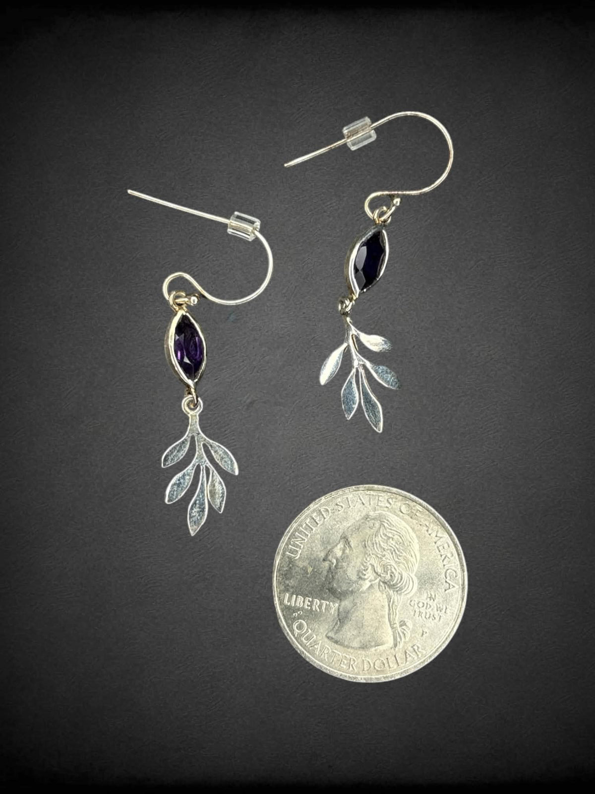 Silver leaf earrings with purple gemstone