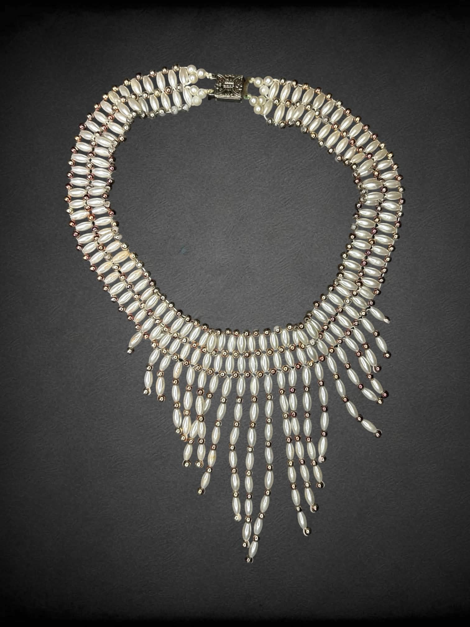 White beaded choker with dangling beads on front