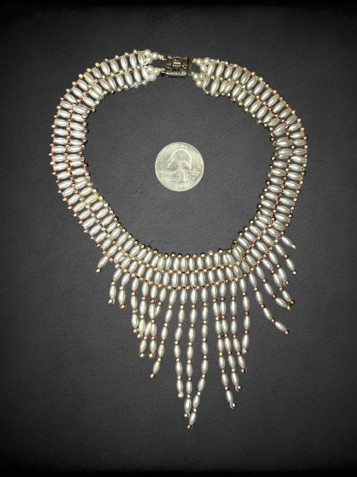 White beaded choker with dangling beads on front