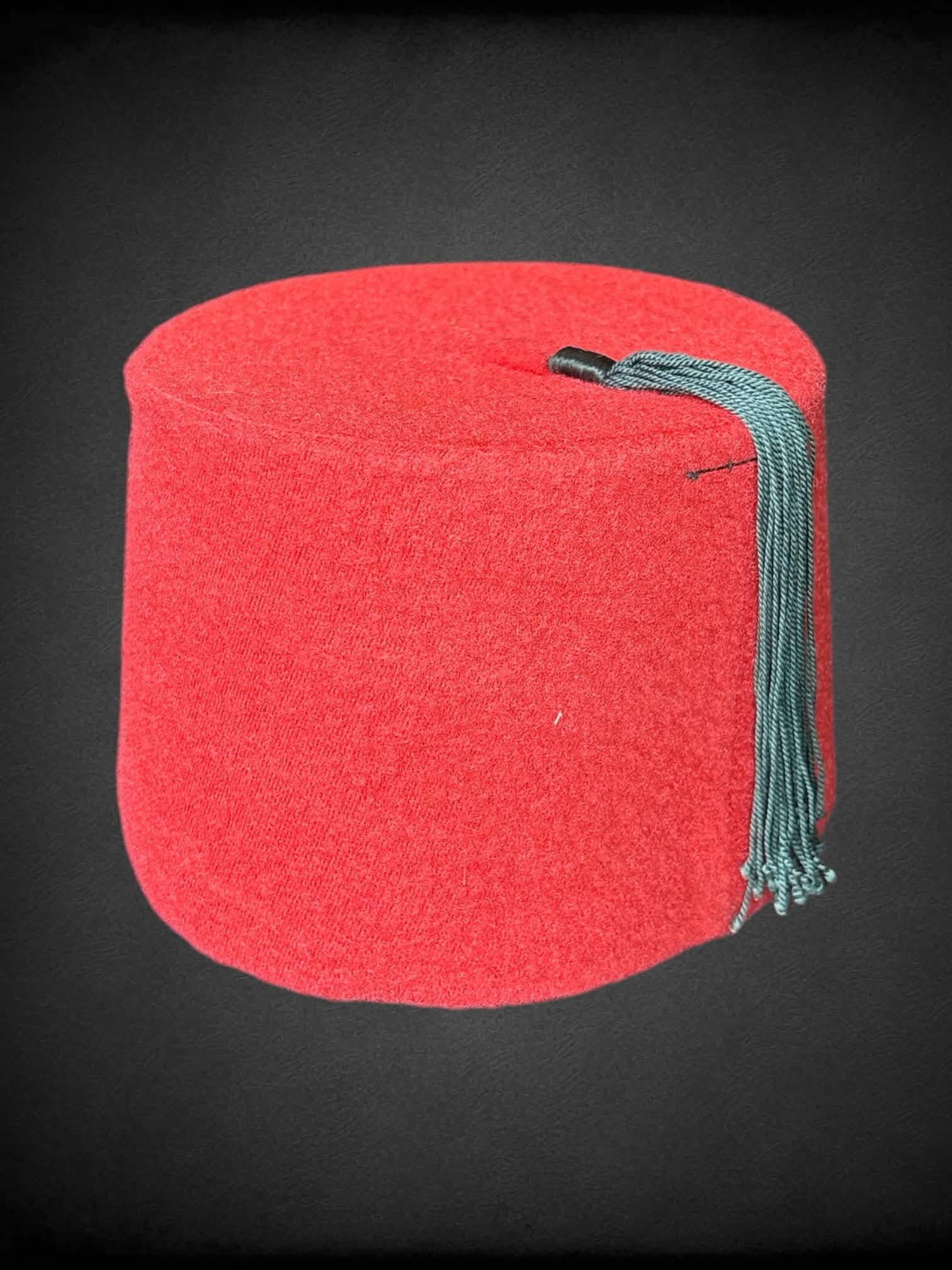 Red fez with black tassel