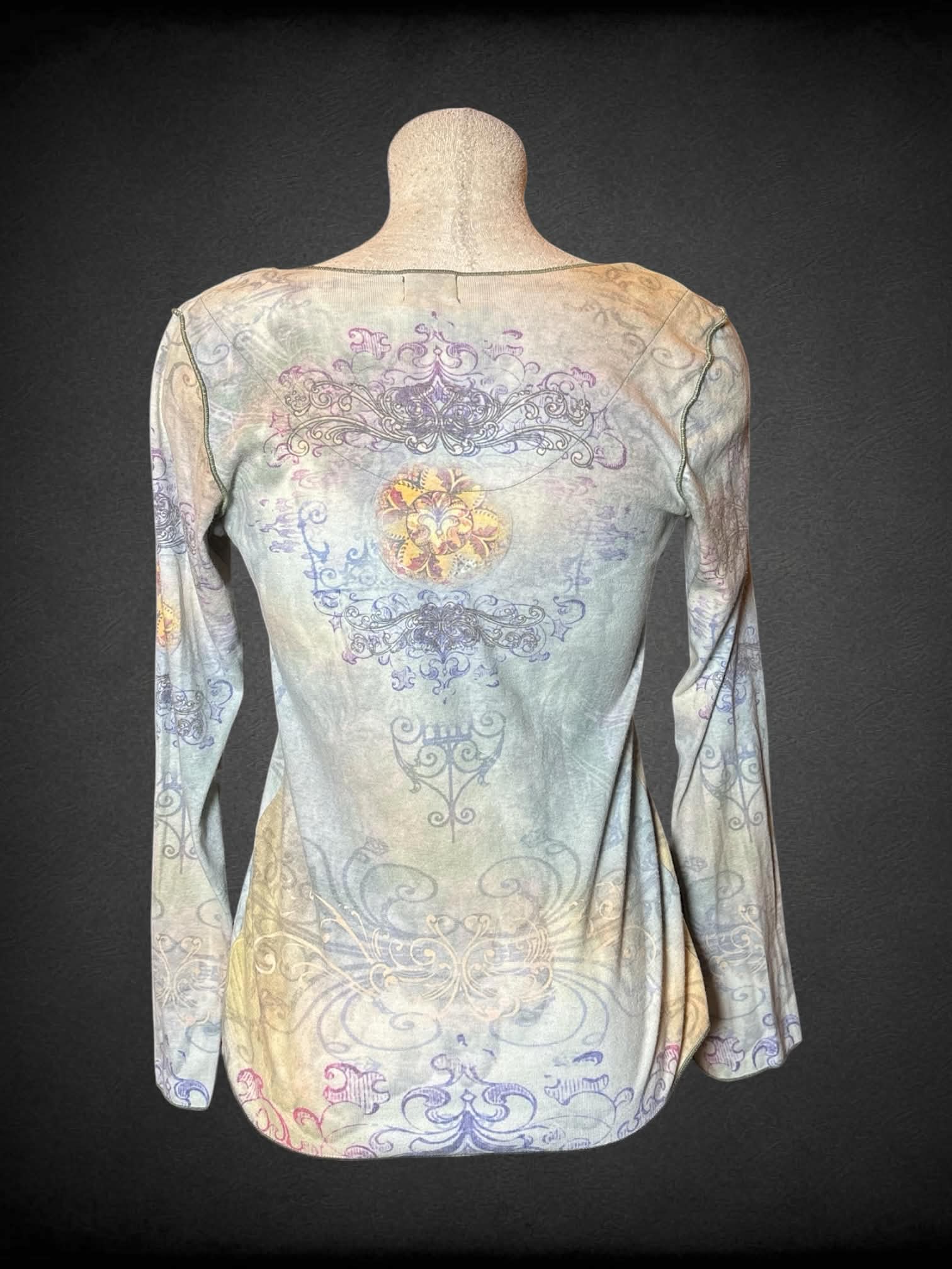L One World pale green long-sleeve shirt with vector flourish and gemstone design
