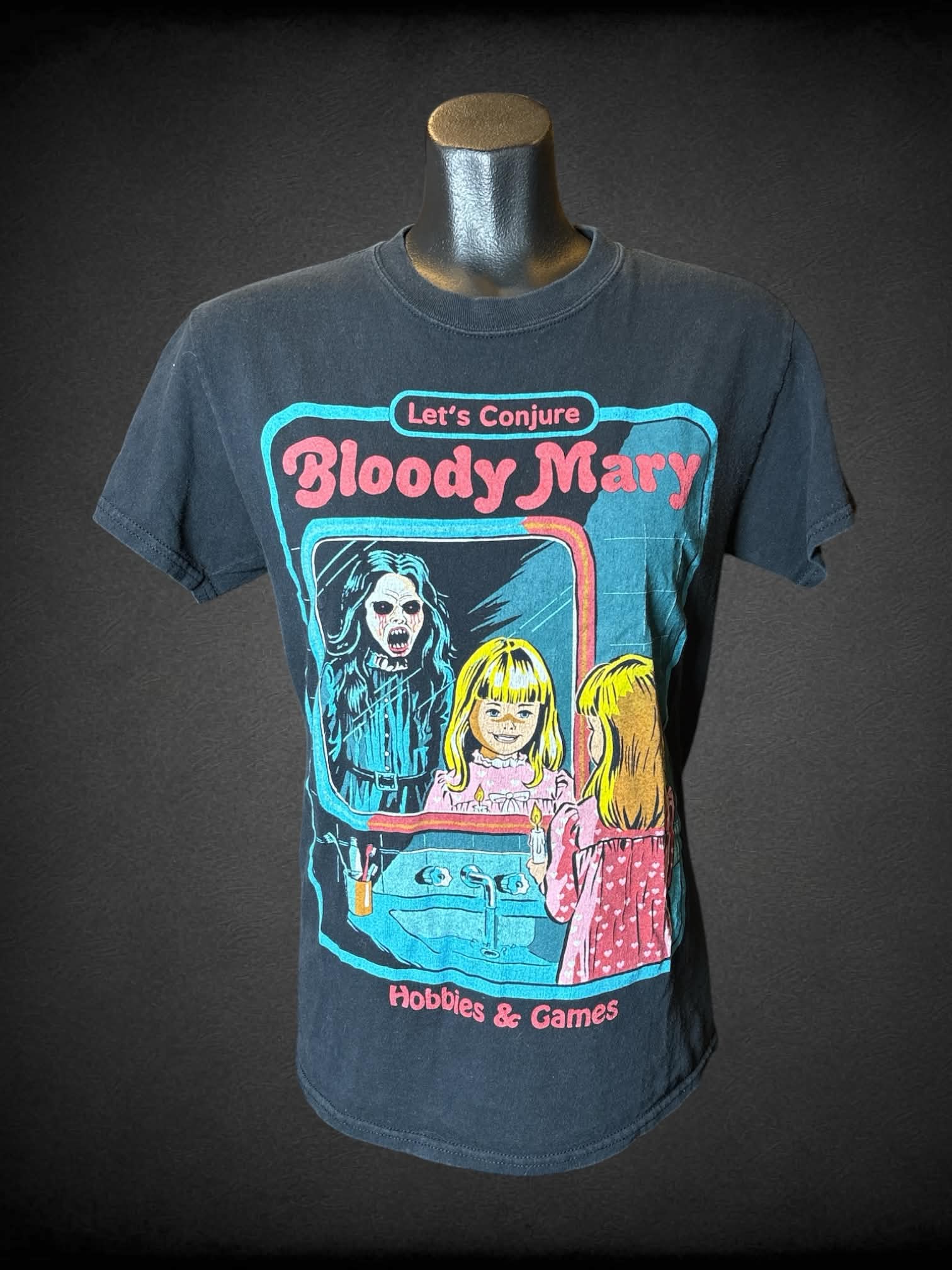 M Creepy Co black t shirt with “Let’s Conjure Bloody Mary” graphic on front