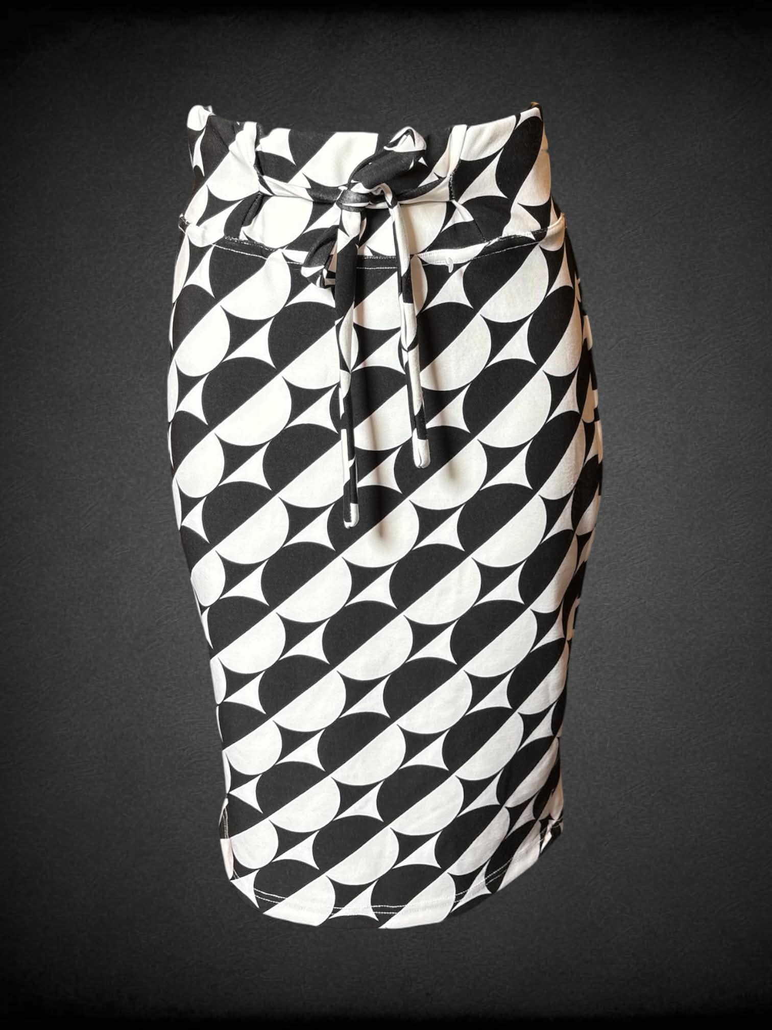 S Classic Concepts white pencil skirt with black circular pattern, and tie around waist