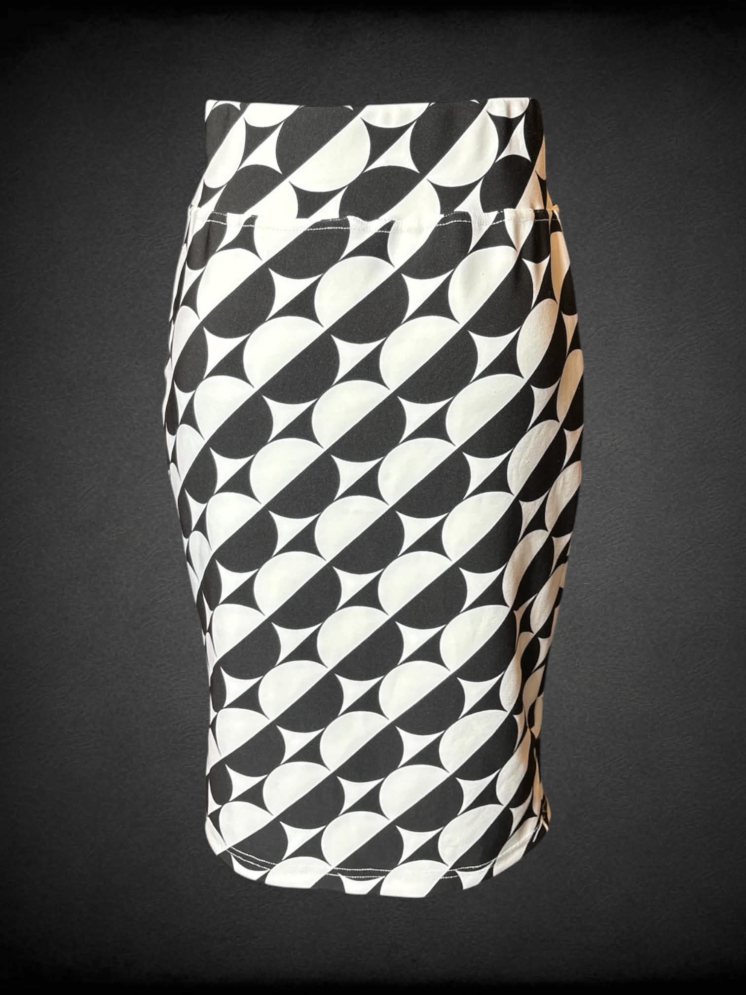 S Classic Concepts white pencil skirt with black circular pattern, and tie around waist