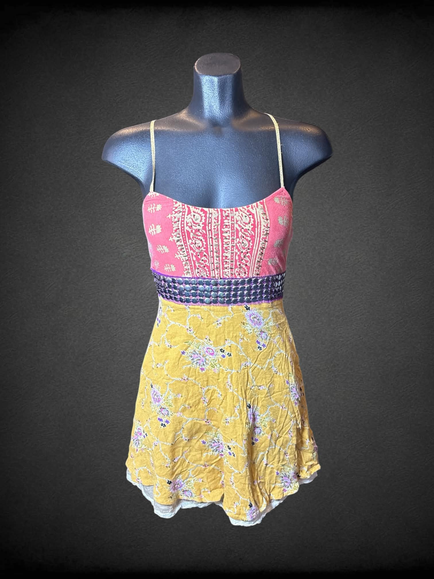 XS Free People yellow & pink short dress with floral pattern, metallic detailing on waist, and zipper on side
