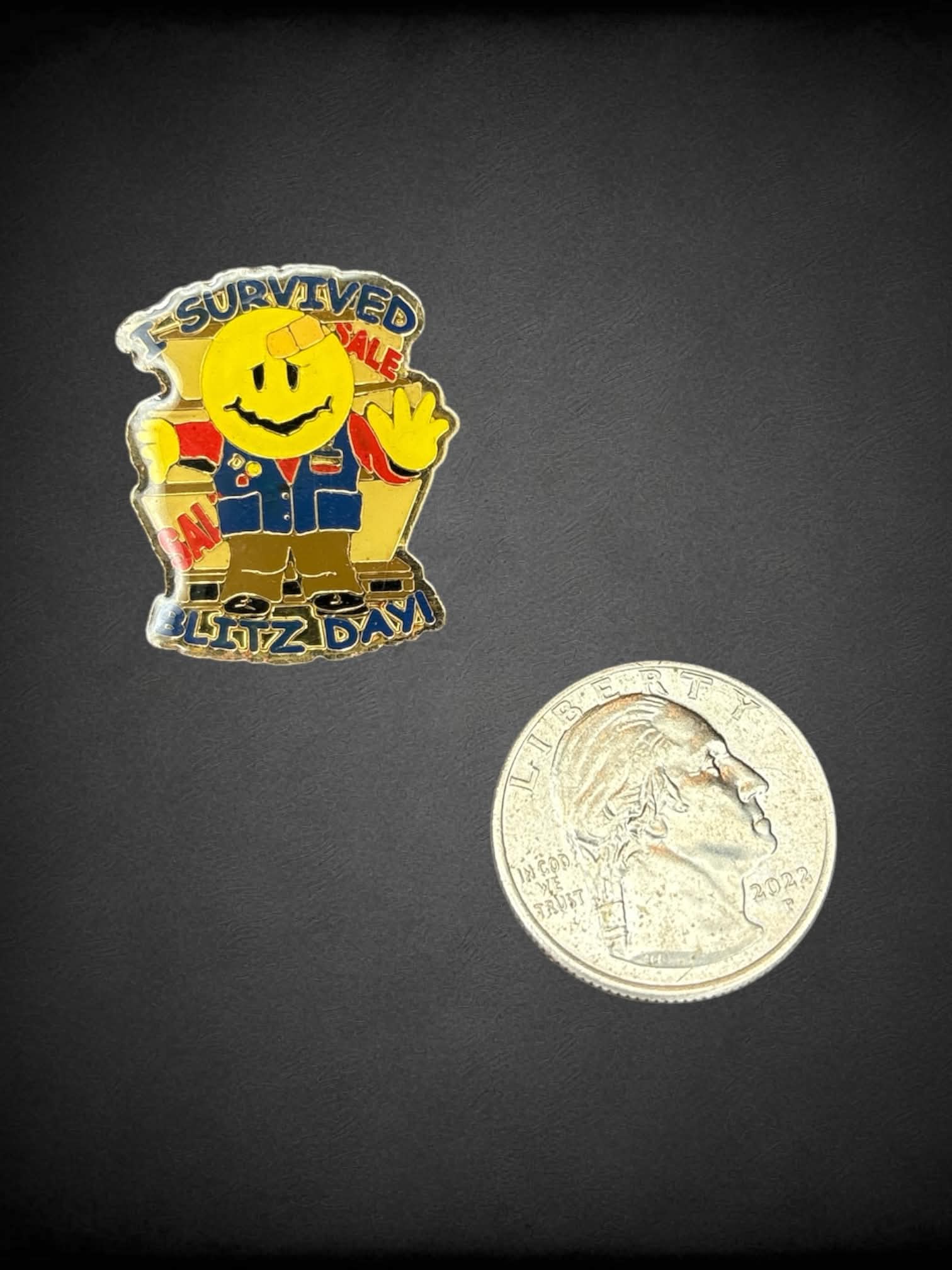 Gold “I Survived Blitz Day!” smiley face enamel pin