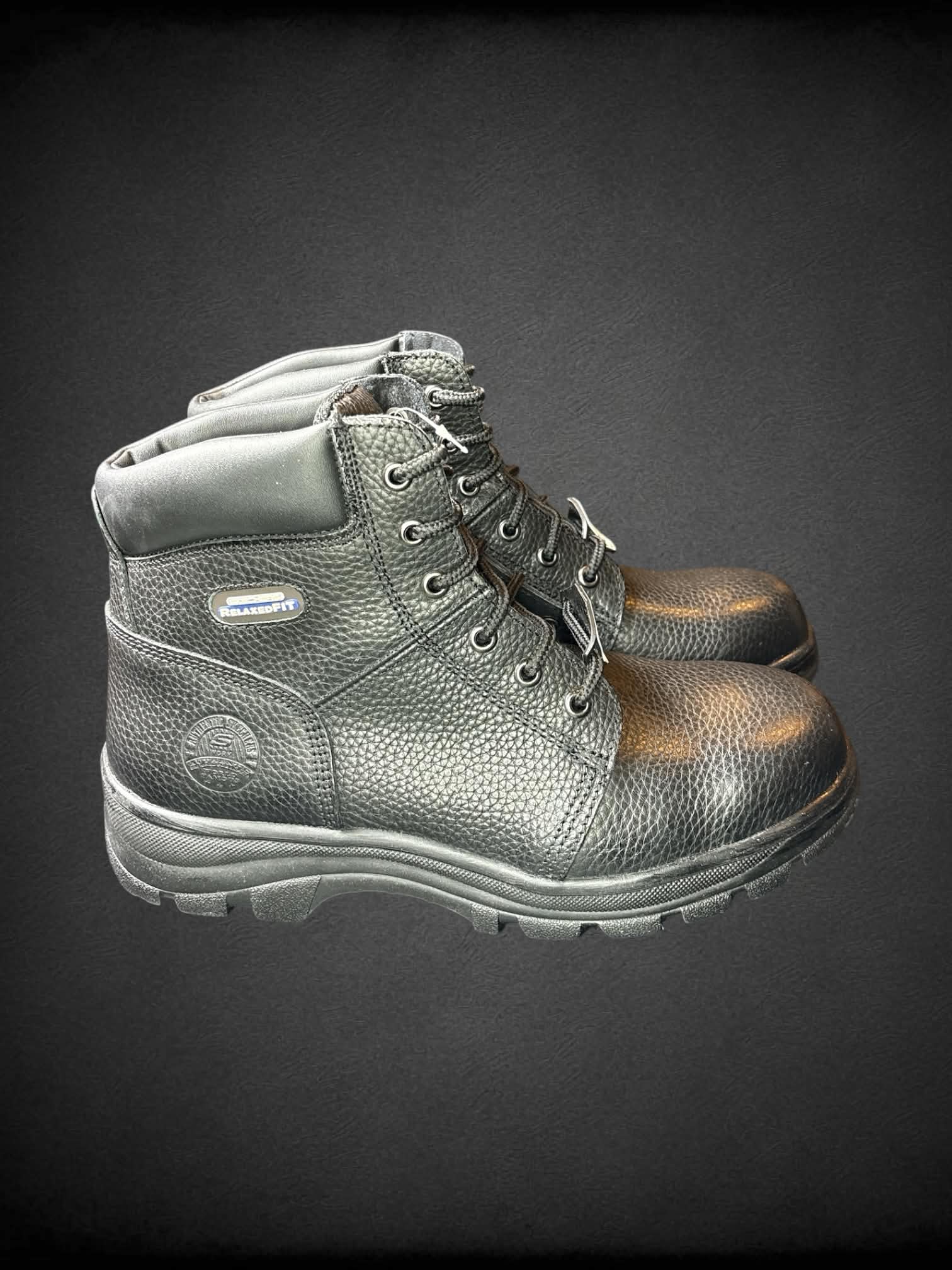 Size 11 Sketchers new in box steel toe relaxed fit black boots, with memory foam