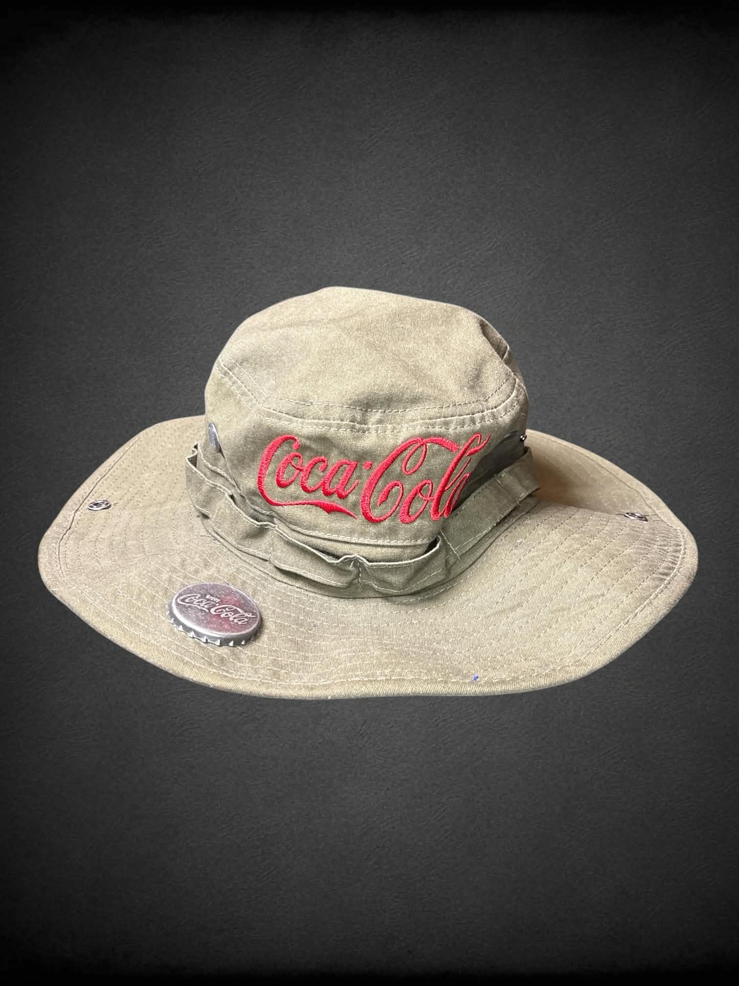 Coco Cola army green boonie bucket hat with metal bottle opener on brim, and adjustable chin strap