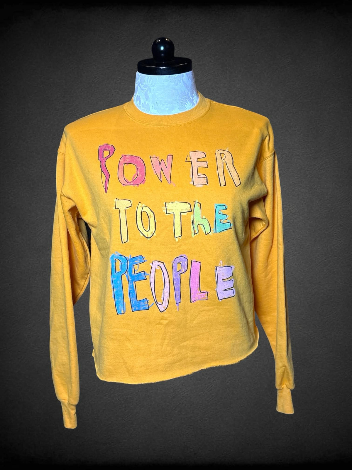 0X Hanes mustard yellow crewneck with “Power To The People” sketch writing on front, and cropped hemline