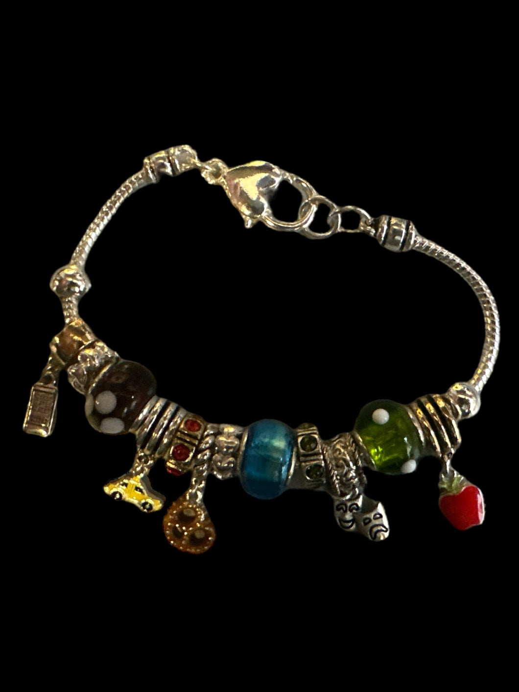 Silverlike charm bracelet w/ variety of charms, & heart lobster closure