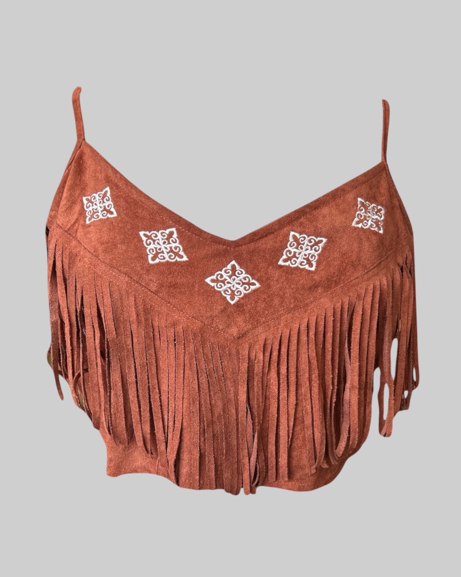 1x reddish brown color crop top with embroidery, fringe, and shirred back