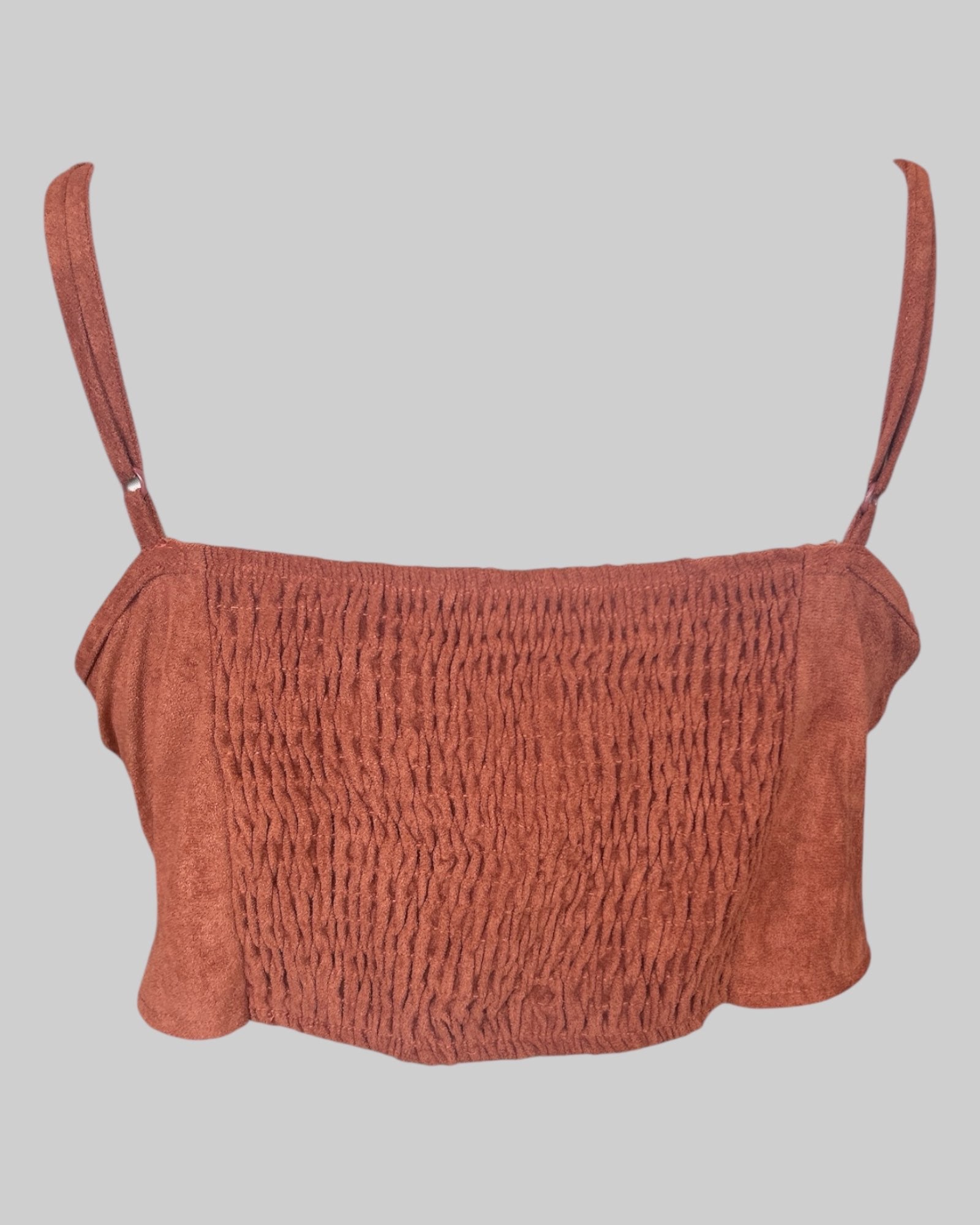 1x reddish brown color crop top with embroidery, fringe, and shirred back