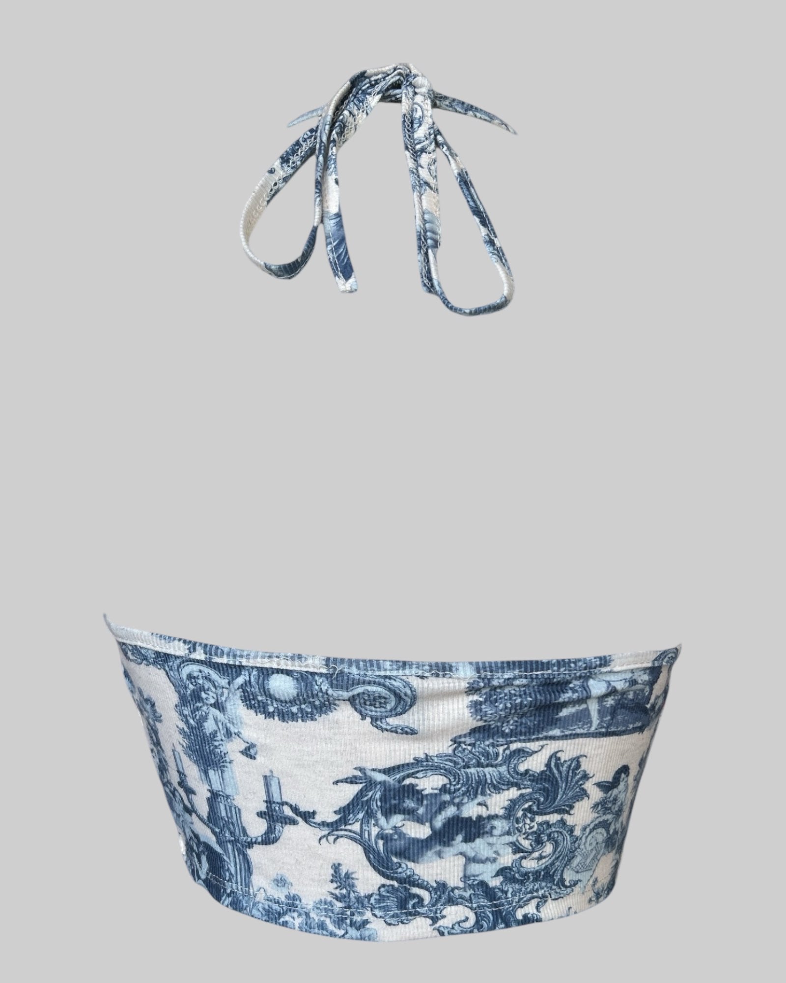 S blue and white draped halter top with floral and cherub design