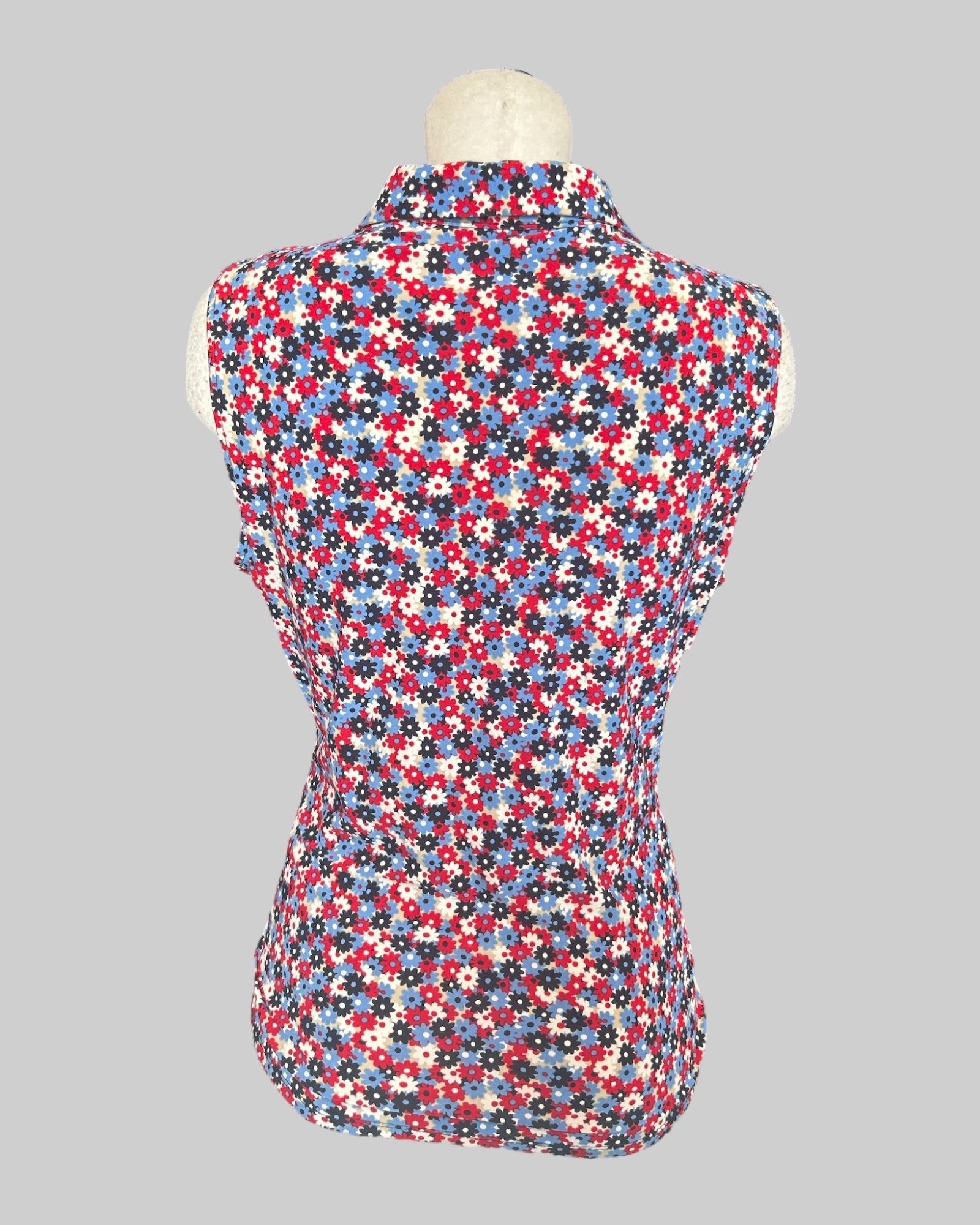 XL stretchy and flowy sleeveless top with blue, red, black, and white florals and a quarter zipper