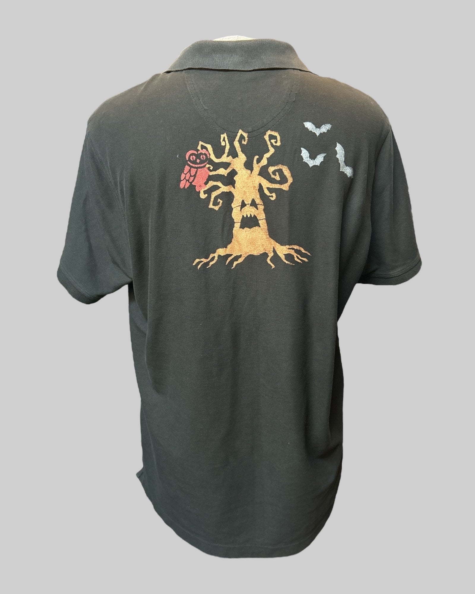 1x black polo with snake patch and hand painted design on back