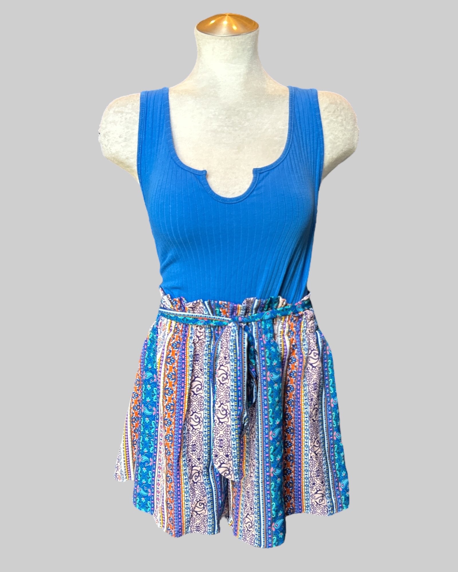 1x blue romper with multi pattern bottoms and tie belt